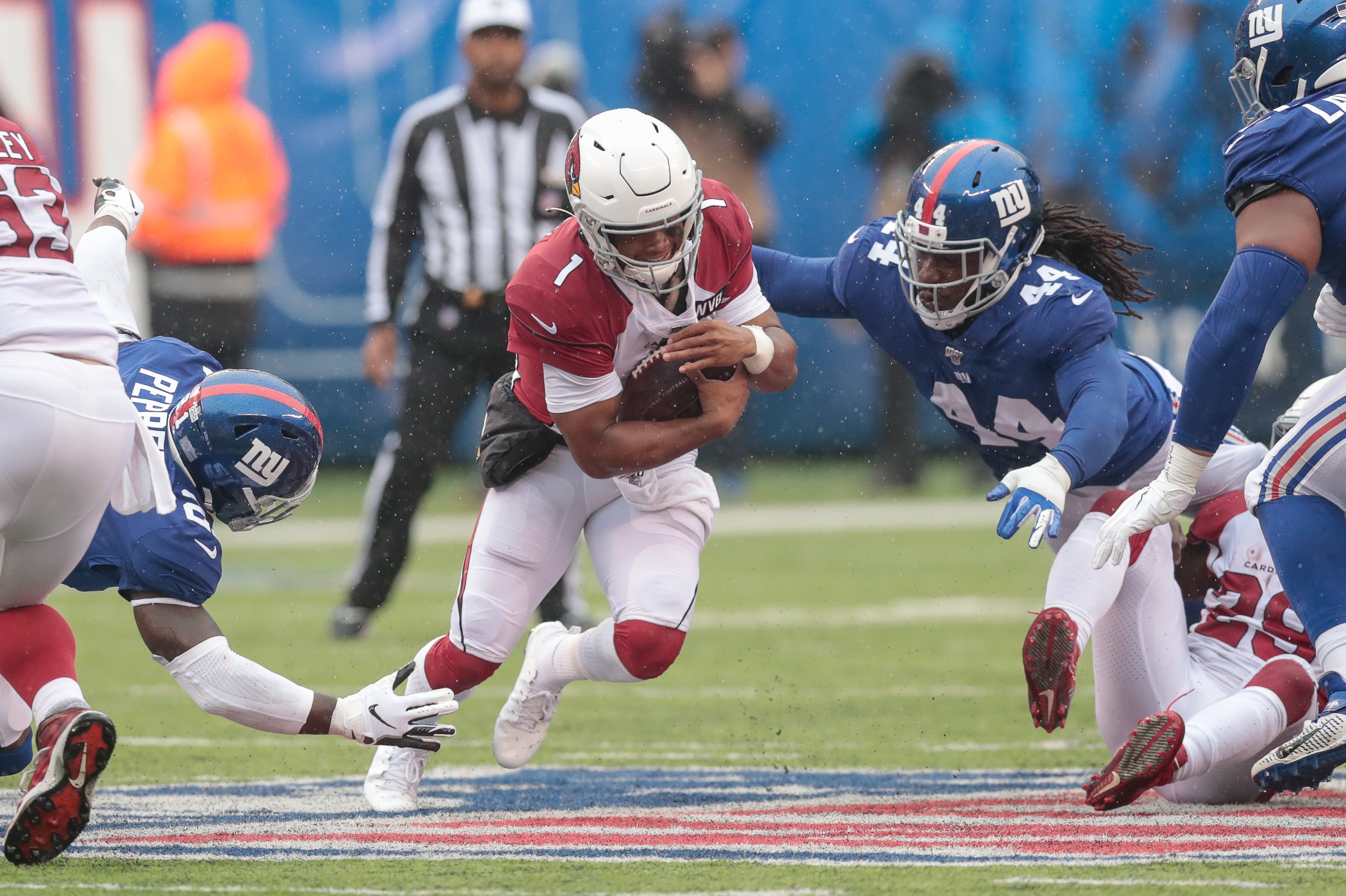 Oct 20, 2019; East Rutherford, NJ, USA; Arizona Cardinals quarterback Kyler Murray (1) rushes for yards as New York Giants linebacker Markus Golden (44) tackles during the first half at MetLife Stadium. Mandatory Credit: Vincent Carchietta-USA TODAY Sports