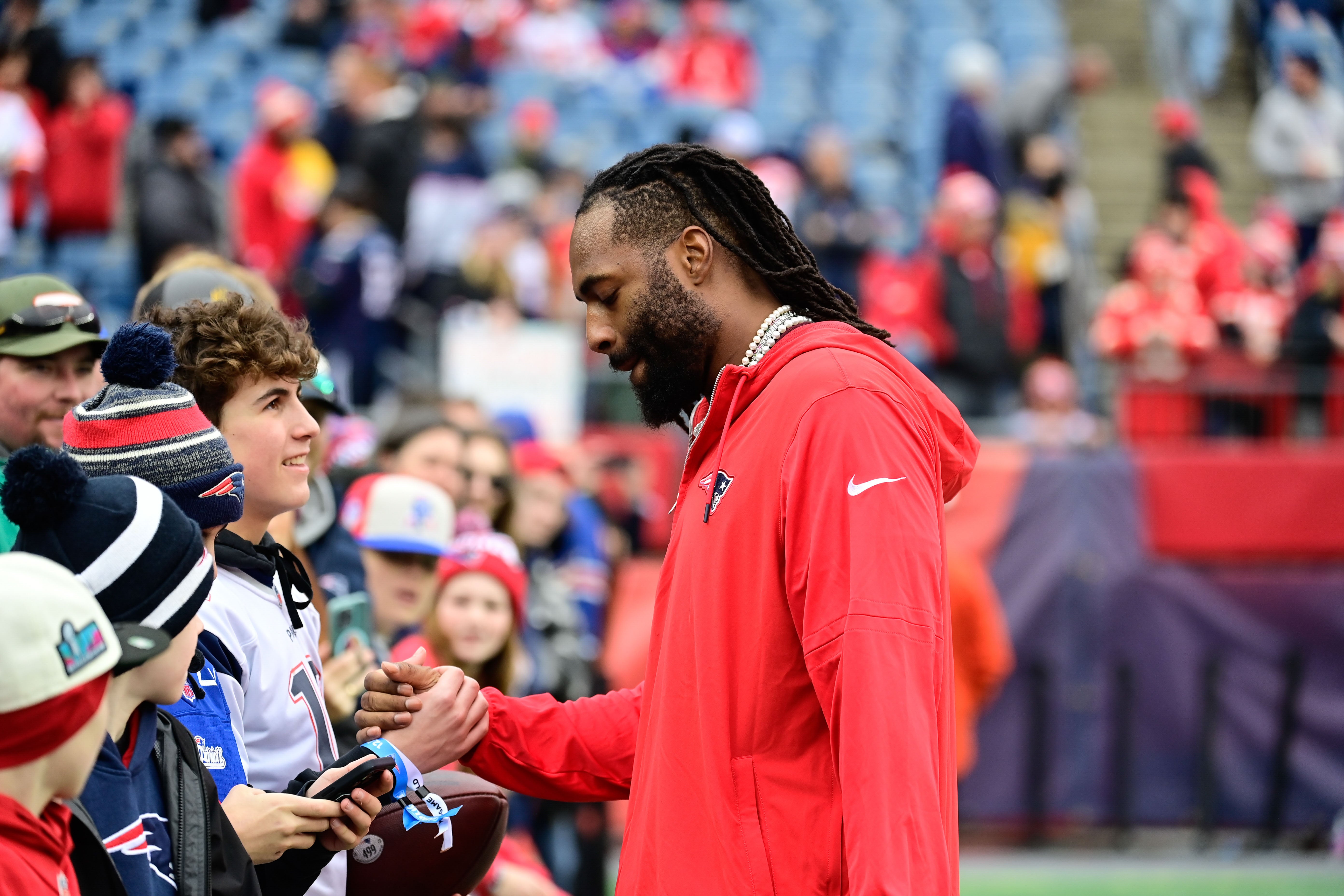 Dec 17, 2023; Foxborough, Massachusetts, USA; New England Patriots linebacker Matthew Judon (9) greets fans before a game against the Kansas City Chiefs at Gillette Stadium