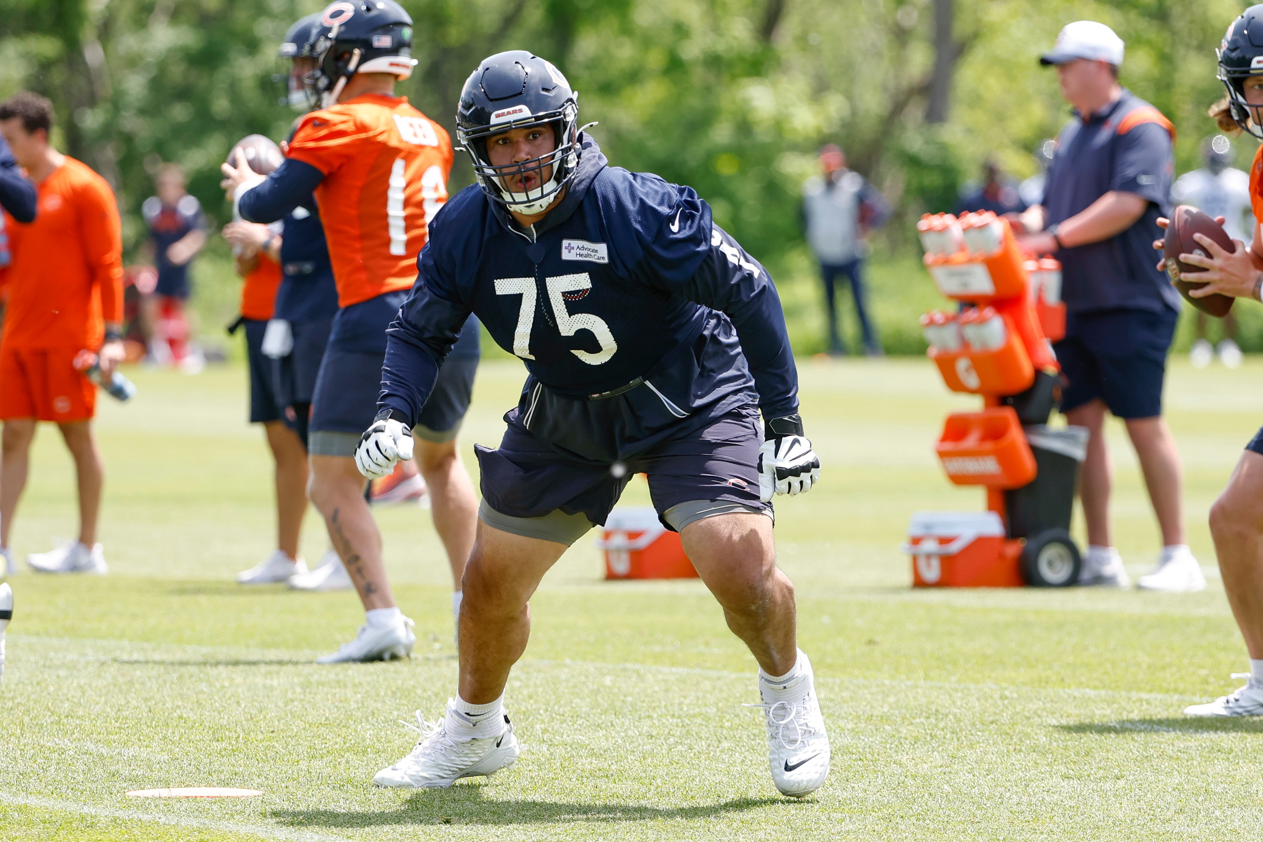 May 31, 2024; Lake Forest, IL, USA; Chicago Bears offensive tackle Larry Borom (75) runs during organized team activities at Halas Hall.