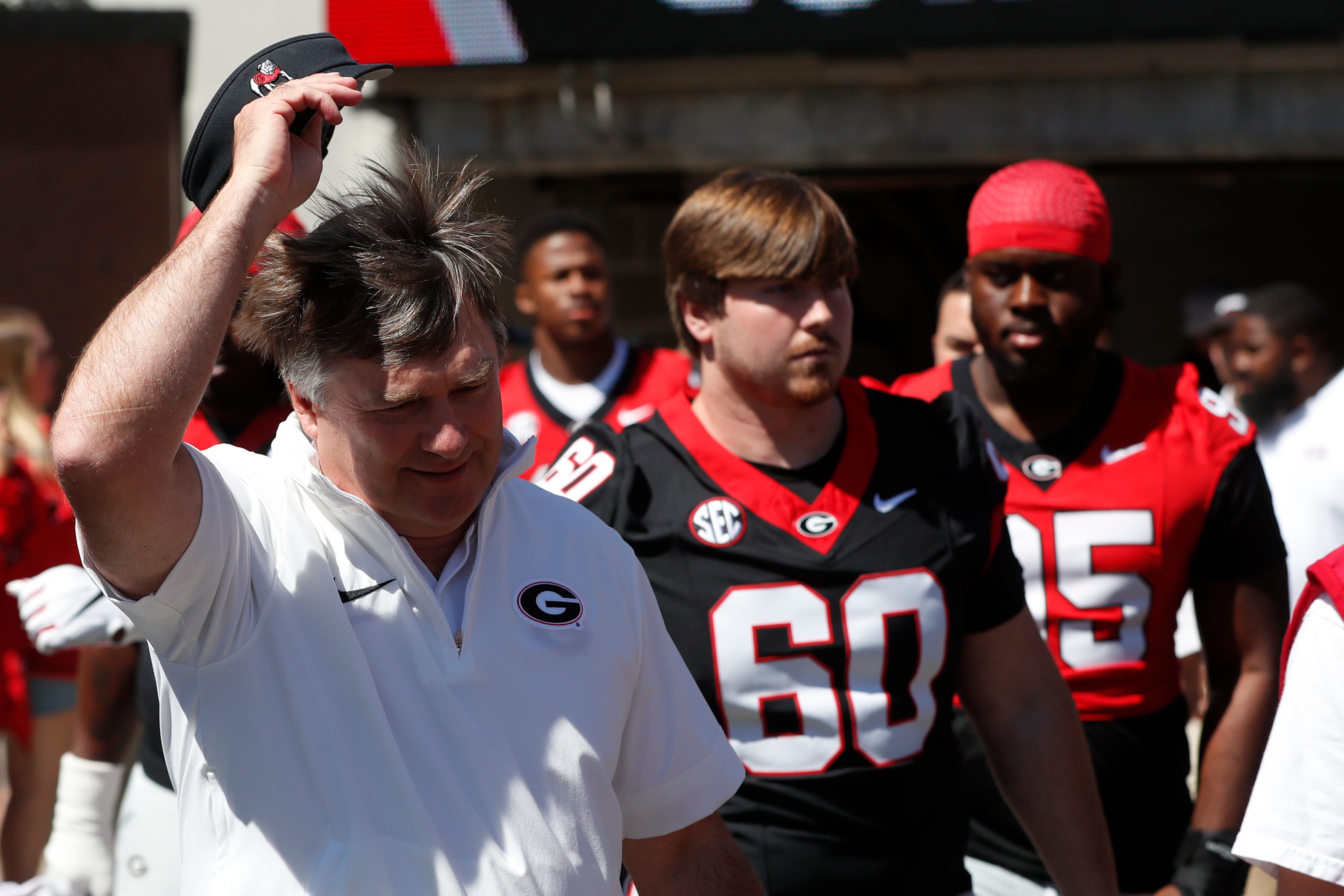 Georgia coach Kirby Smart arrives with the team before the start of the G-Day spring football game in Athens, Ga., on Saturday, April 13, 2024.