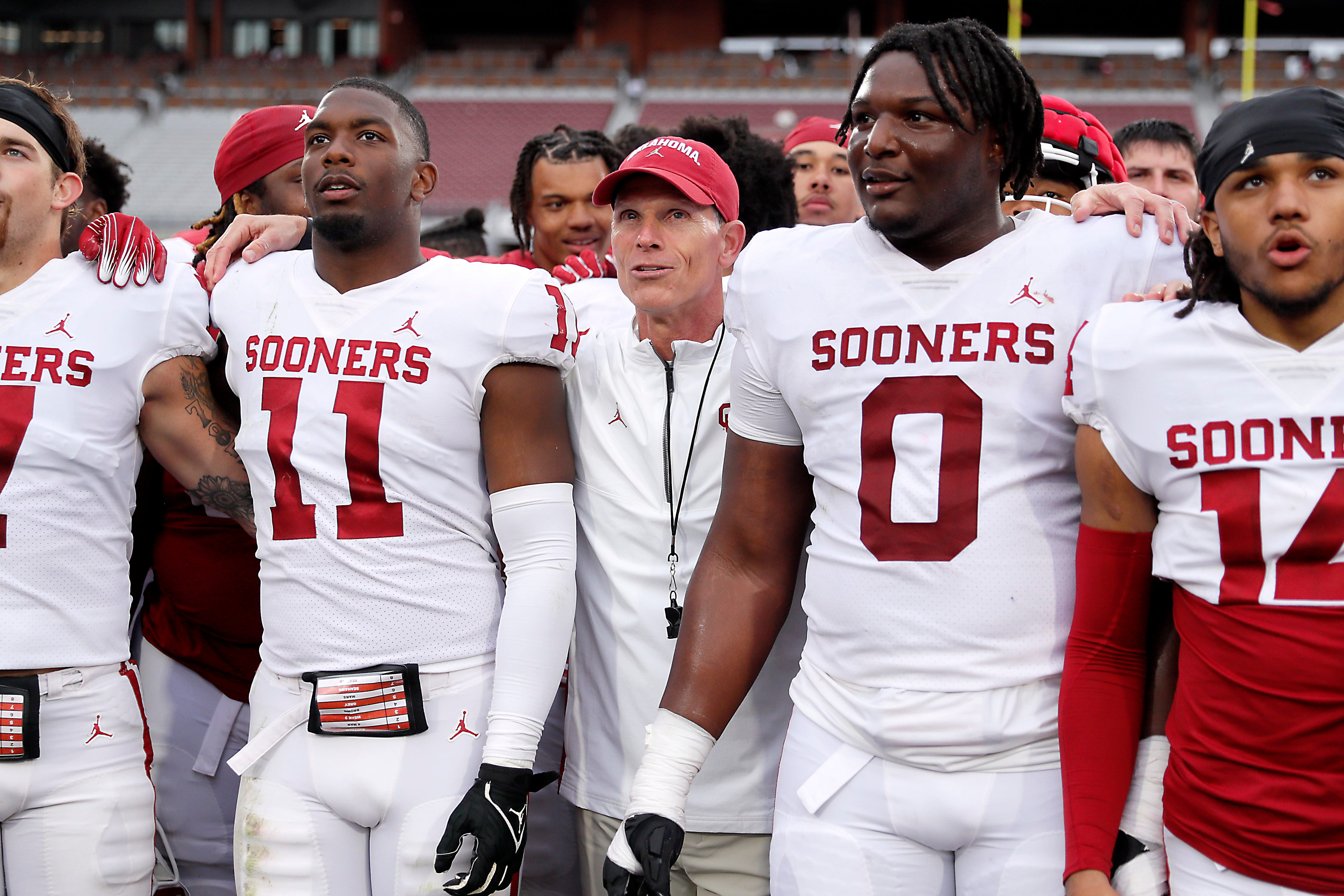 Oklahoma coach Brent Venables stands beside Kobie McKinzie (11) and David Stone (0) after a University of Oklahoma (OU) Sooners spring football game at Gaylord Family-Oklahoma Memorial Stadium in Norman, Okla., Saturday, April 20, 2024.