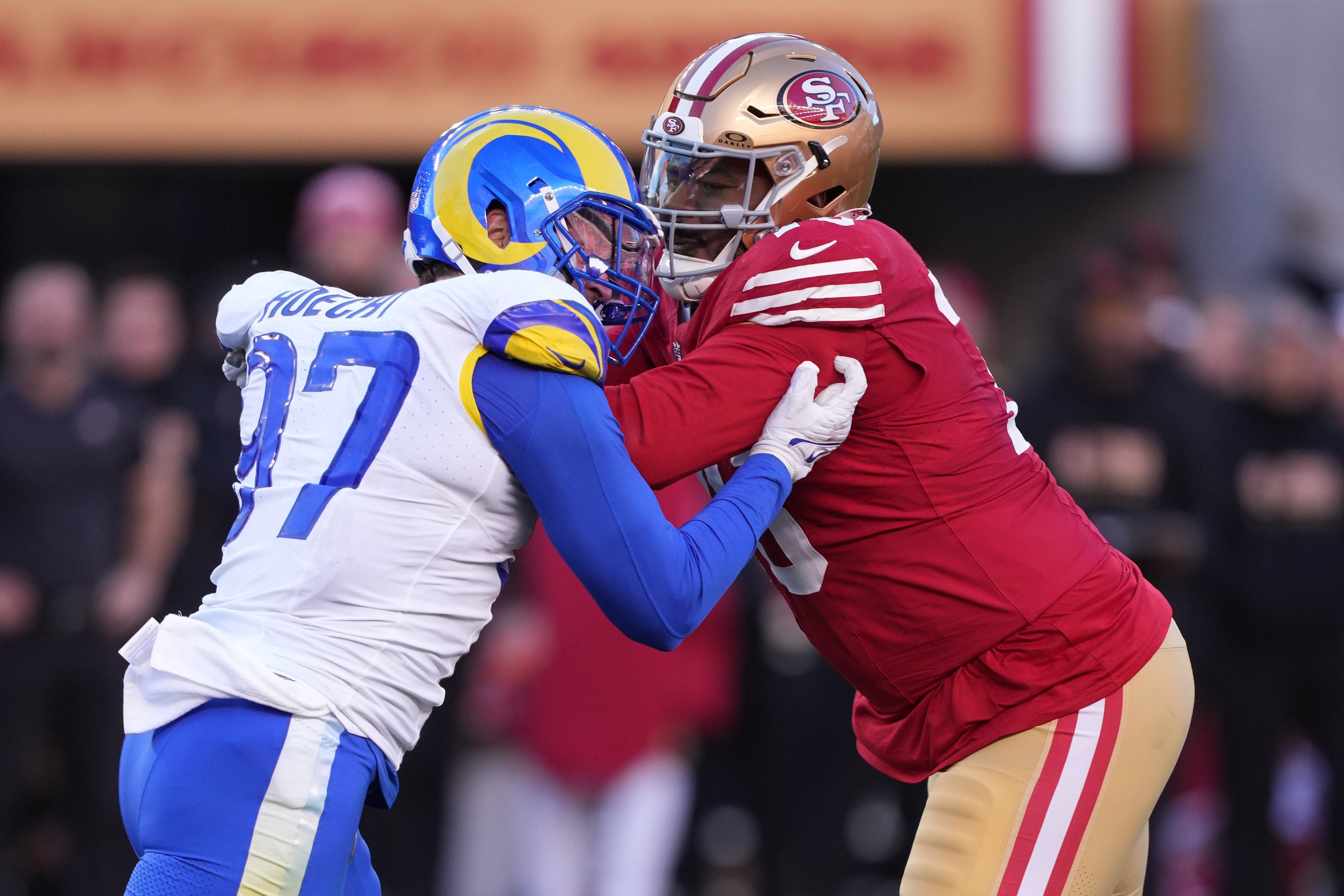 Jan 7, 2024; Santa Clara, California, USA; San Francisco 49ers guard Jaylon Moore (right) blocks Los Angeles Rams linebacker Michael Hoecht (97) during the third quarter at Levi's Stadium.