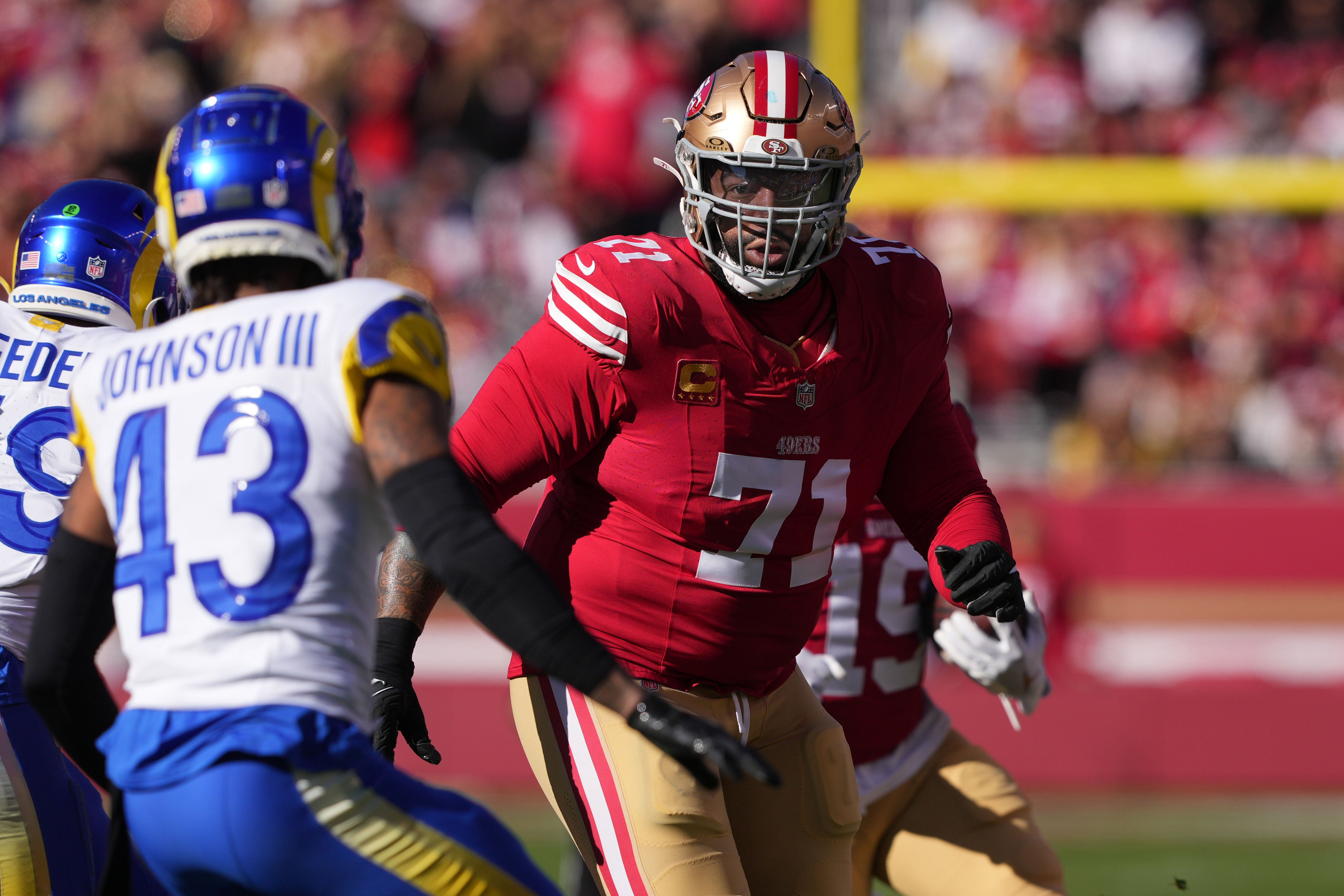 Jan 7, 2024; Santa Clara, California, USA; San Francisco 49ers offensive tackle Trent Williams (71) blocks against Los Angeles Rams safety John Johnson III (43) during the first quarter at Levi's Stadium.
