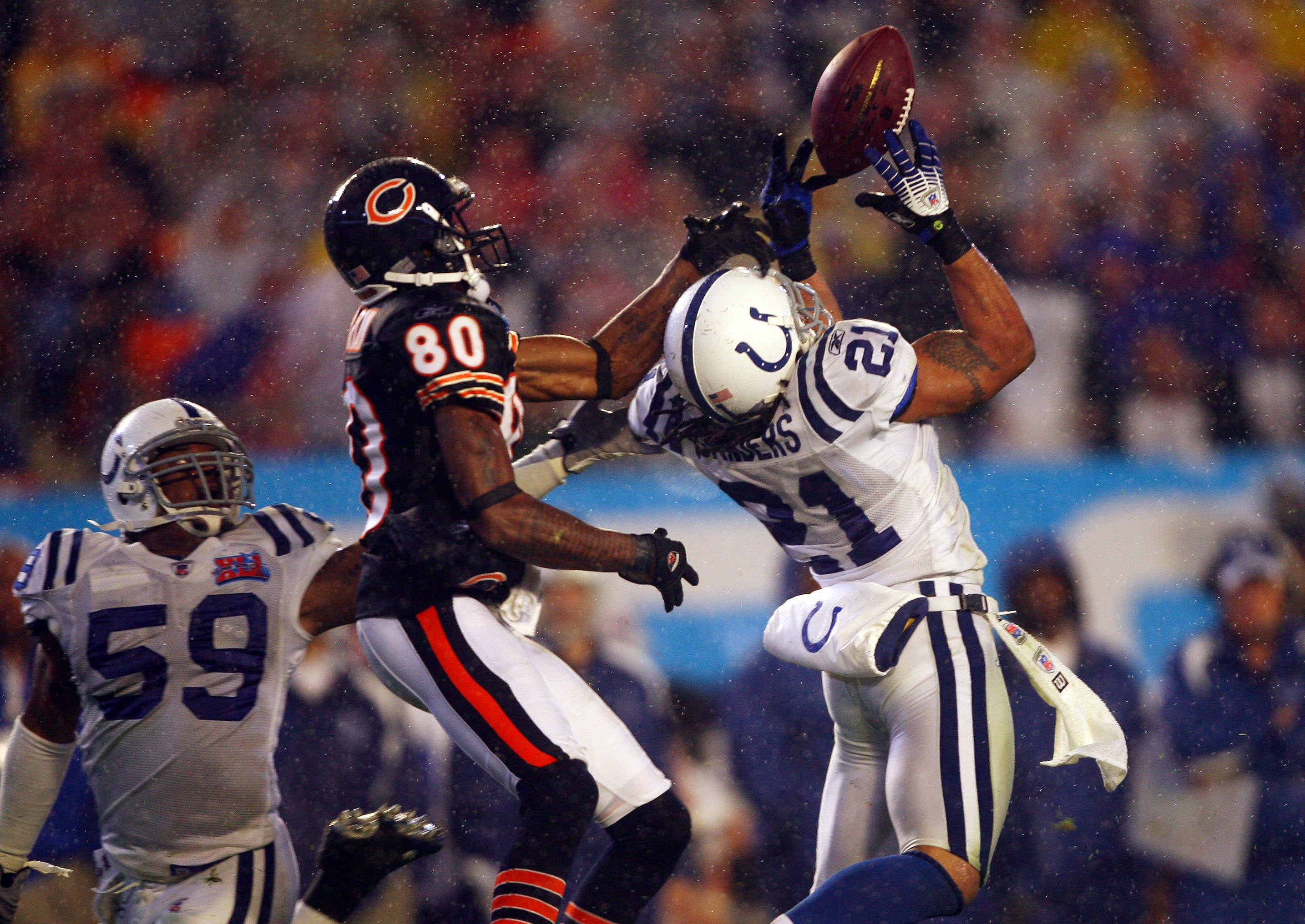 Feb 4, 2007; Miami, FL, USA; Indianapolis Colts safety Bob Sanders (21) intercepts a ball intended for Chicago Bears receiver Bernard Berrian (80) in the second half of Super Bowl XLI at Dolphins Stadium. The Indianapolis Colts defeated the Chicago Bears 29-17.