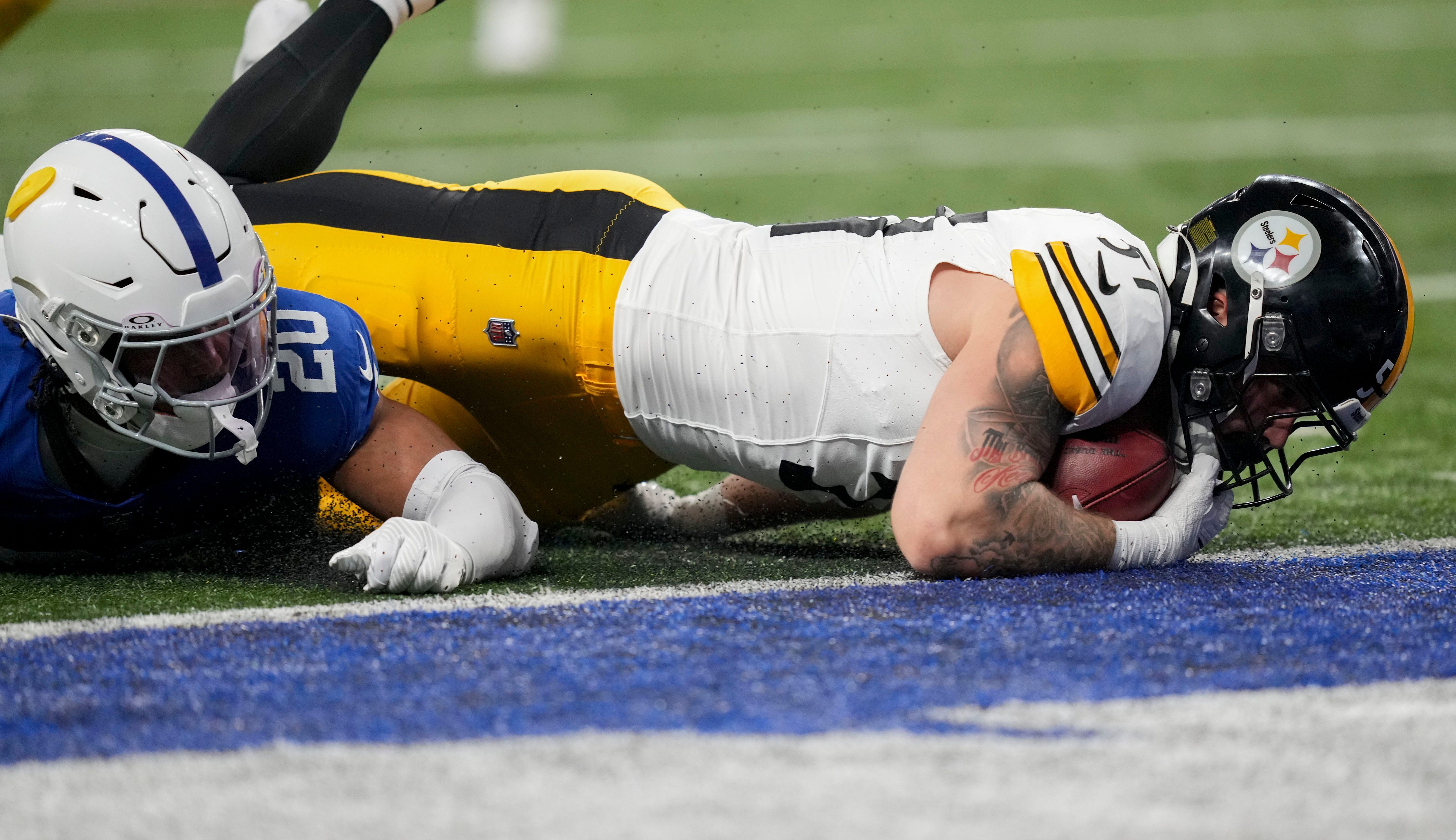 Indianapolis Colts safety Nick Cross (20) dives toward the ball as Pittsburgh Steelers linebacker Nick Herbig (51) recovers a blocked punt near the end zone Saturday, Dec. 16, 2023, during a game against the Pittsburgh Steelers at Lucas Oil Stadium in Indianapolis.