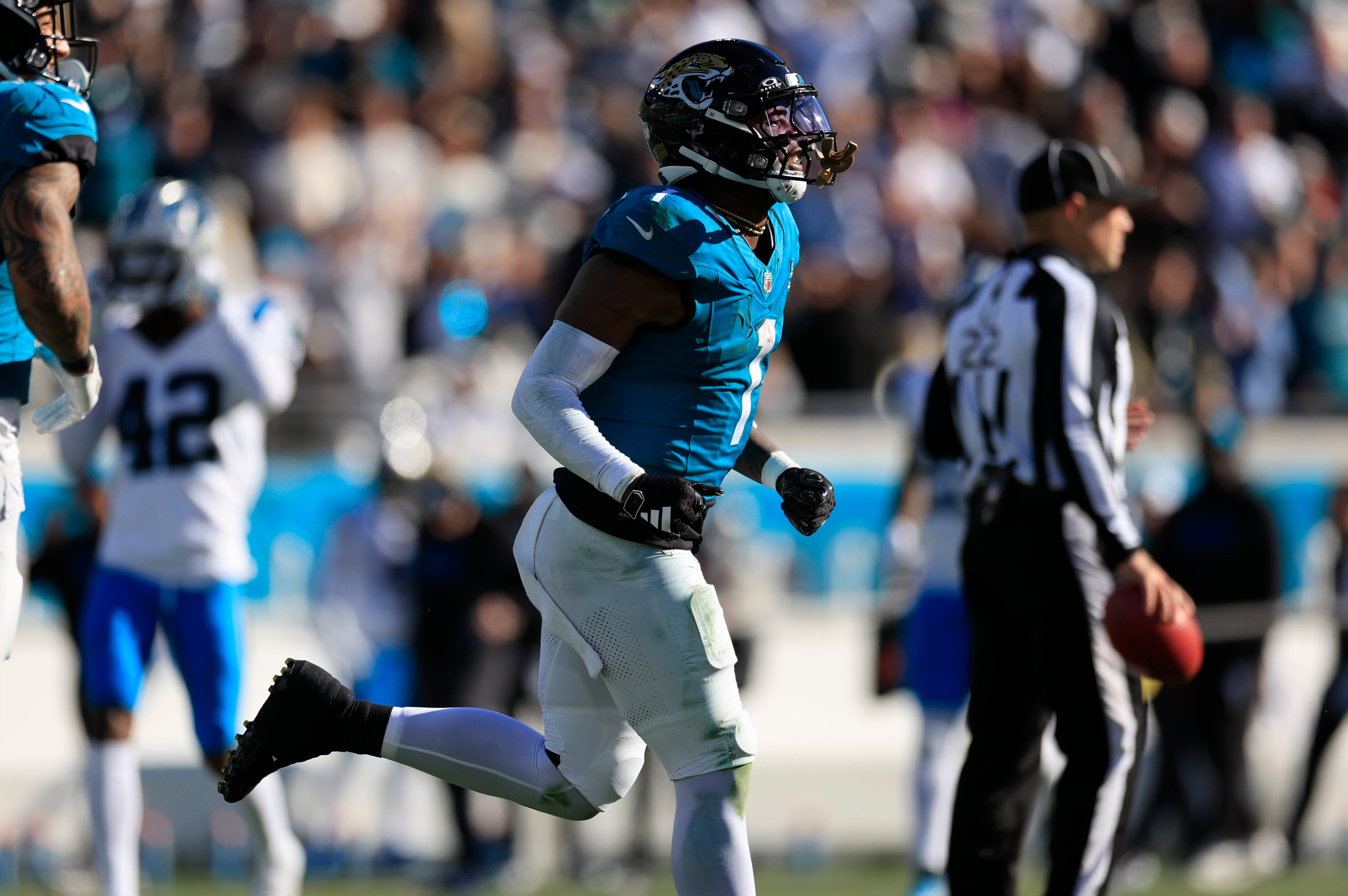 Jacksonville Jaguars running back Travis Etienne Jr. (1) runs to the sideline after scoring a touchdown during the third quarter of a regular season NFL football matchup Sunday, Dec. 31, 2023 at EverBank Stadium in Jacksonville, Fla. The Jacksonville Jaguars blanked the Carolina Panthers 26-0.
