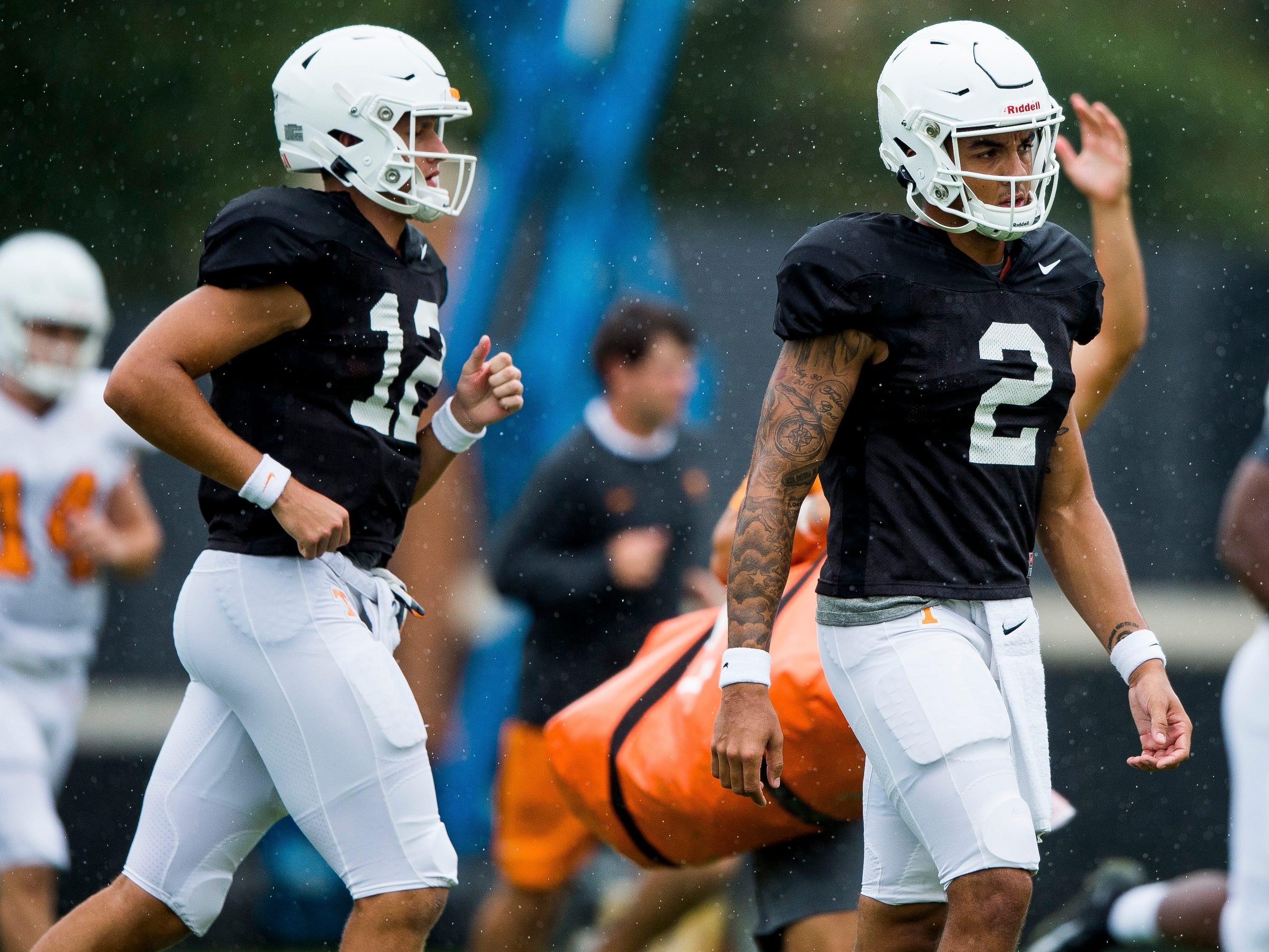 Tennessee quarterback J.T. Shrout (12) and Tennessee quarterback Jarrett Guarantano (2) during Tennessee football practice on Monday, August 26, 2019.