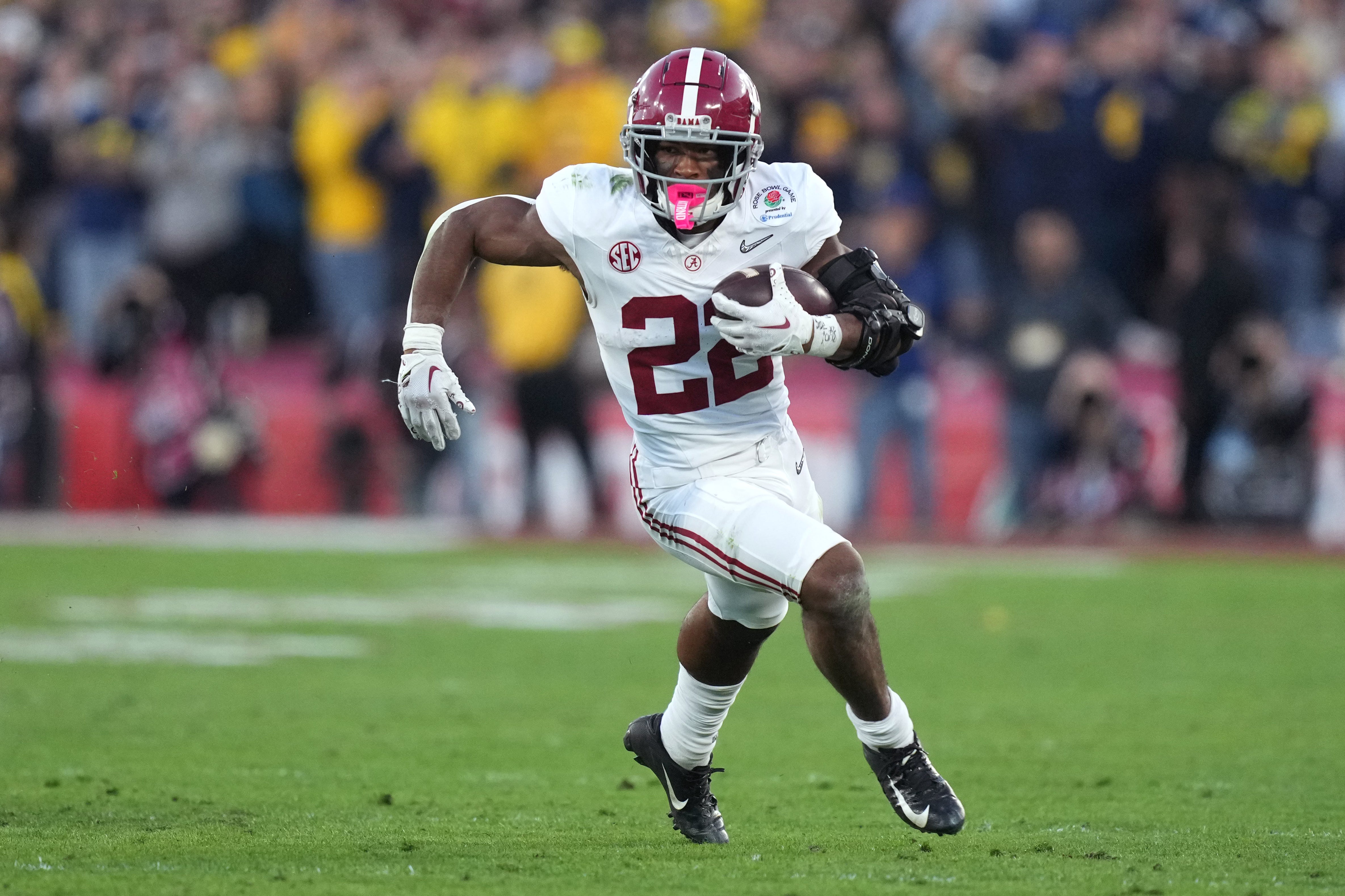 Jan 1, 2024; Pasadena, CA, USA; Alabama Crimson Tide running back Justice Haynes (22) runs the ball against the Michigan Wolverines during the second half in the 2024 Rose Bowl college football playoff semifinal game at Rose Bowl.