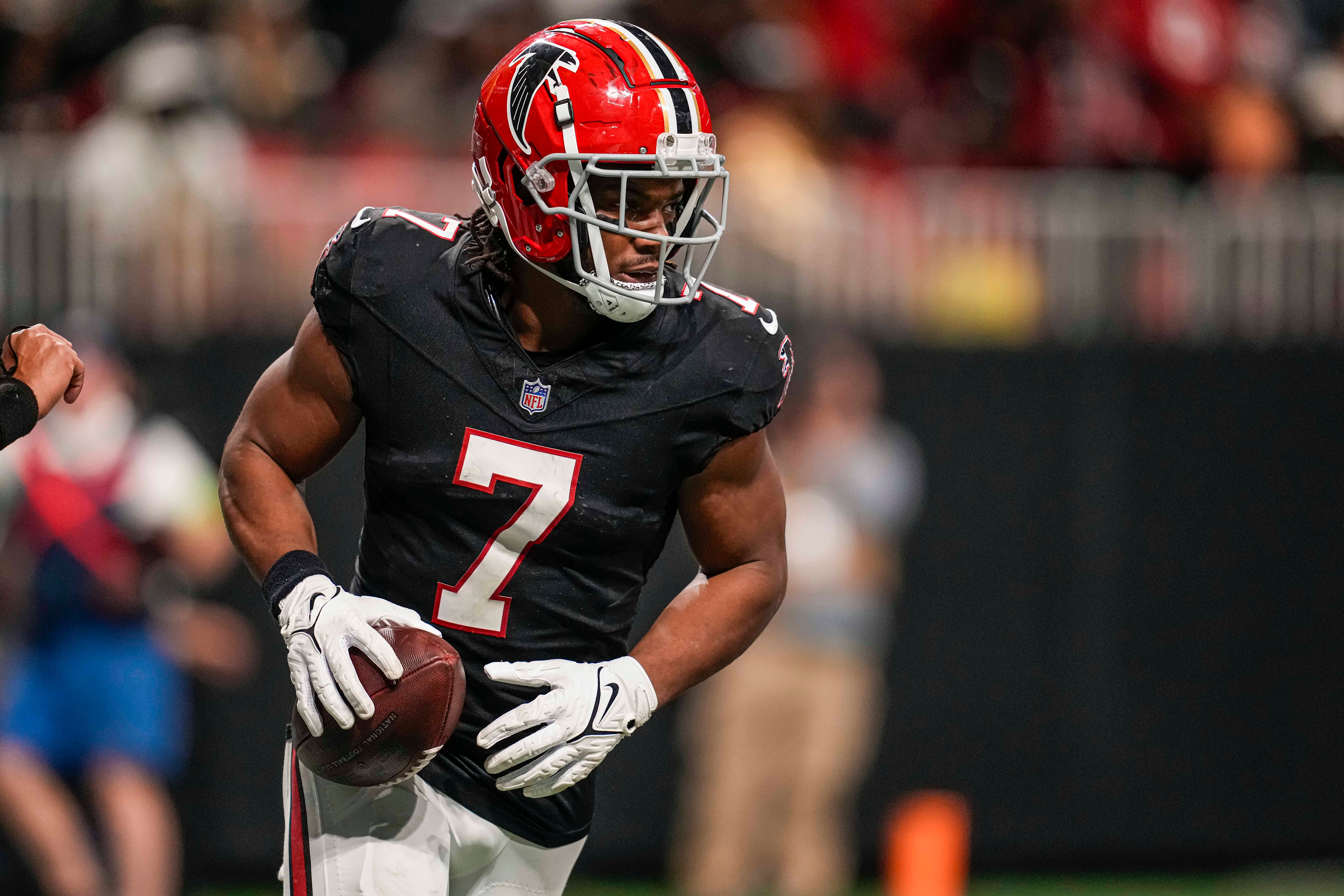 Nov 26, 2023; Atlanta, Georgia, USA; Atlanta Falcons running back Bijan Robinson (7) reacts after scoring a touchdown after a catch against the New Orleans Saints during the second half at Mercedes-Benz Stadium.
