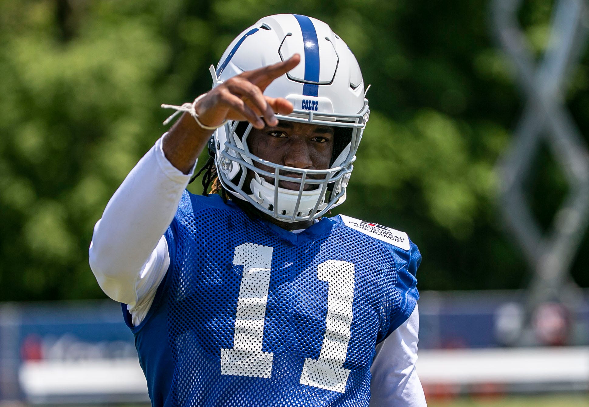 Indianapolis Colts wide receiver Deon Cain (11) waves to a fan during the first day of their preseason training camp at Grand Park in Westfield on Thursday, July 25, 2019. Colts Training Camp Day 1