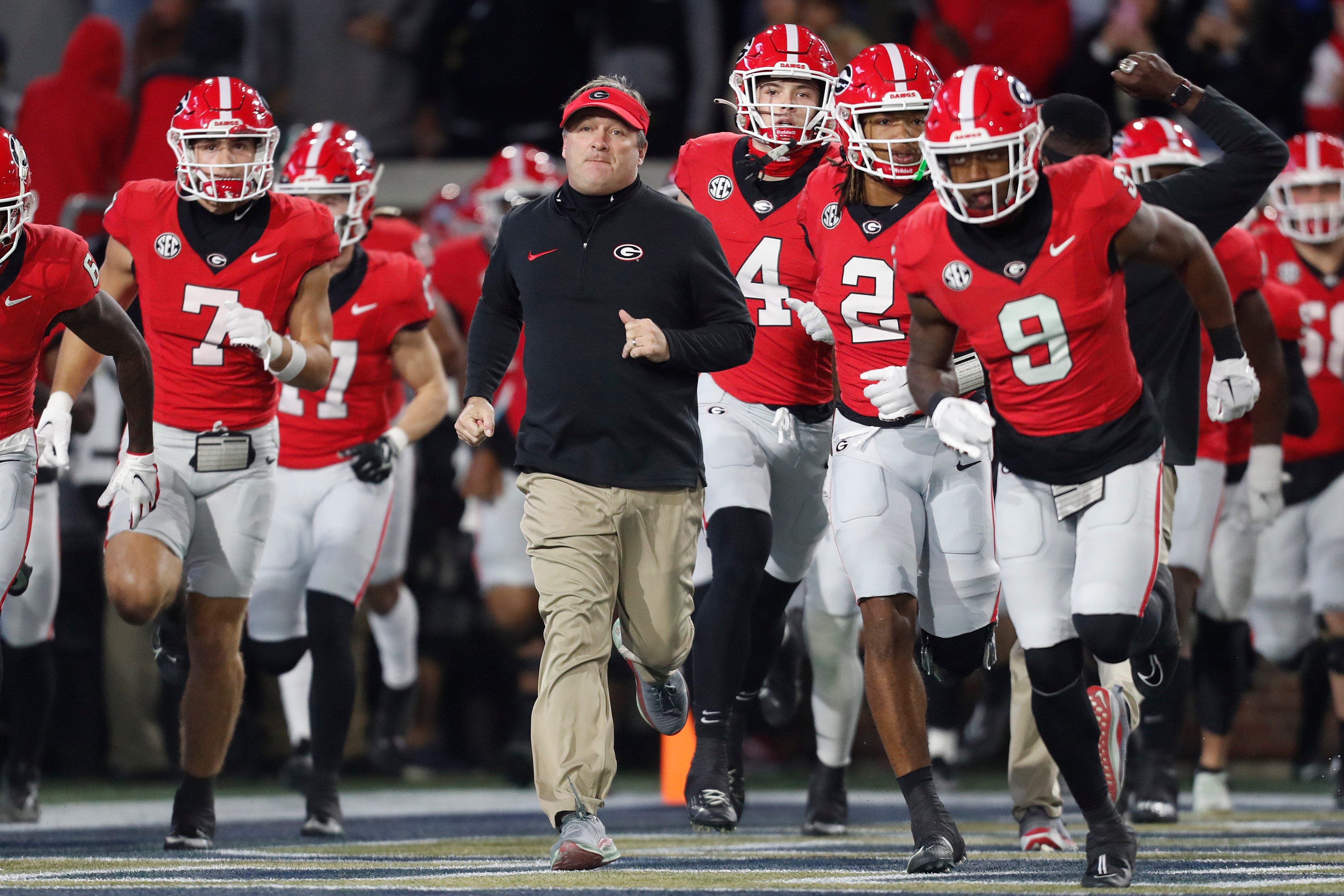 Georgia coach Kirby Smart leads his team onto the field before the first half of a NCAA college football game against Georgia Tech in Atlanta, on Saturday, Nov. 25, 2023.
