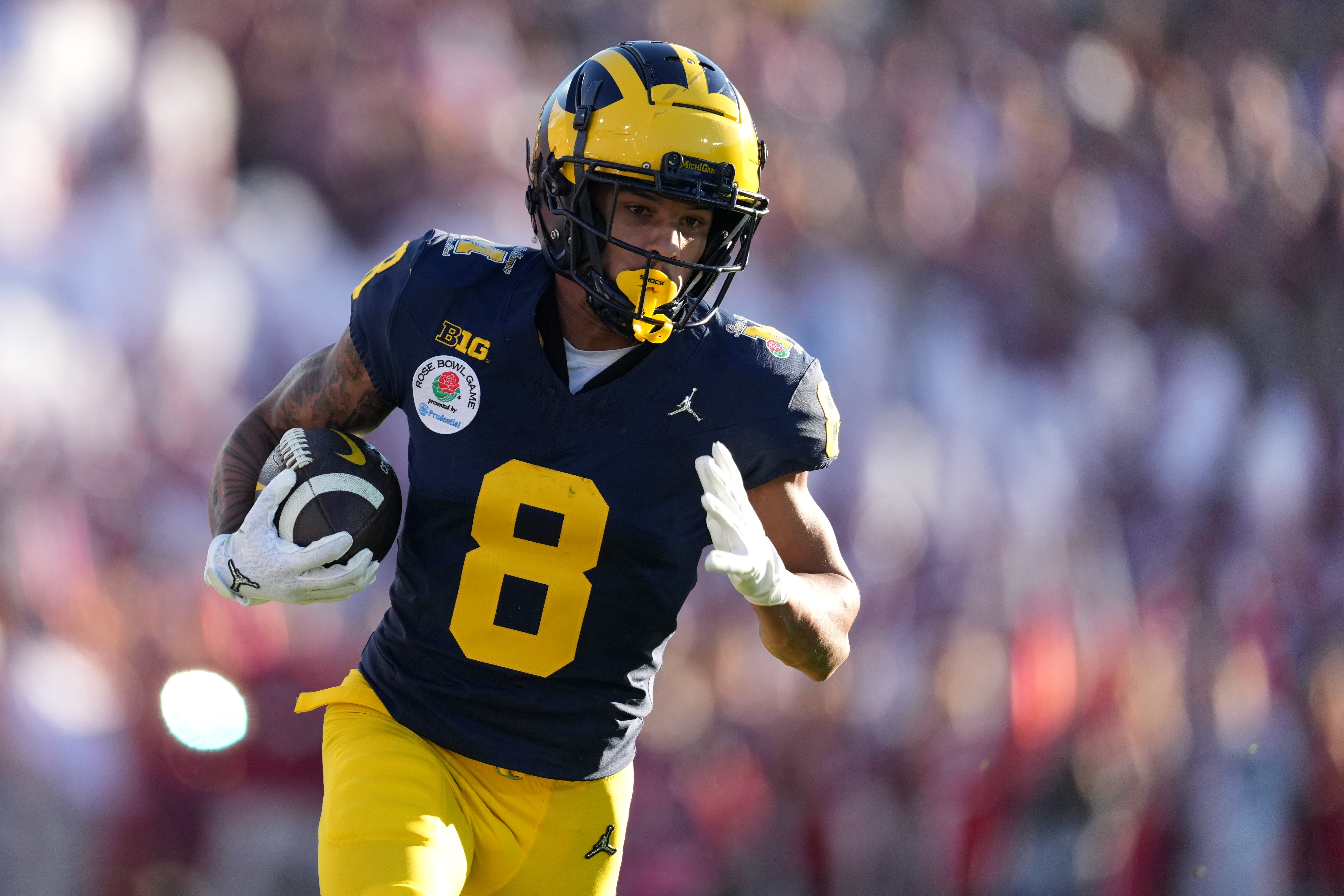 Jan 1, 2024; Pasadena, CA, USA; Michigan Wolverines wide receiver Tyler Morris (8) runs with the ball during the first half against the Alabama Crimson Tide in the 2024 Rose Bowl college football playoff semifinal game at Rose Bowl.