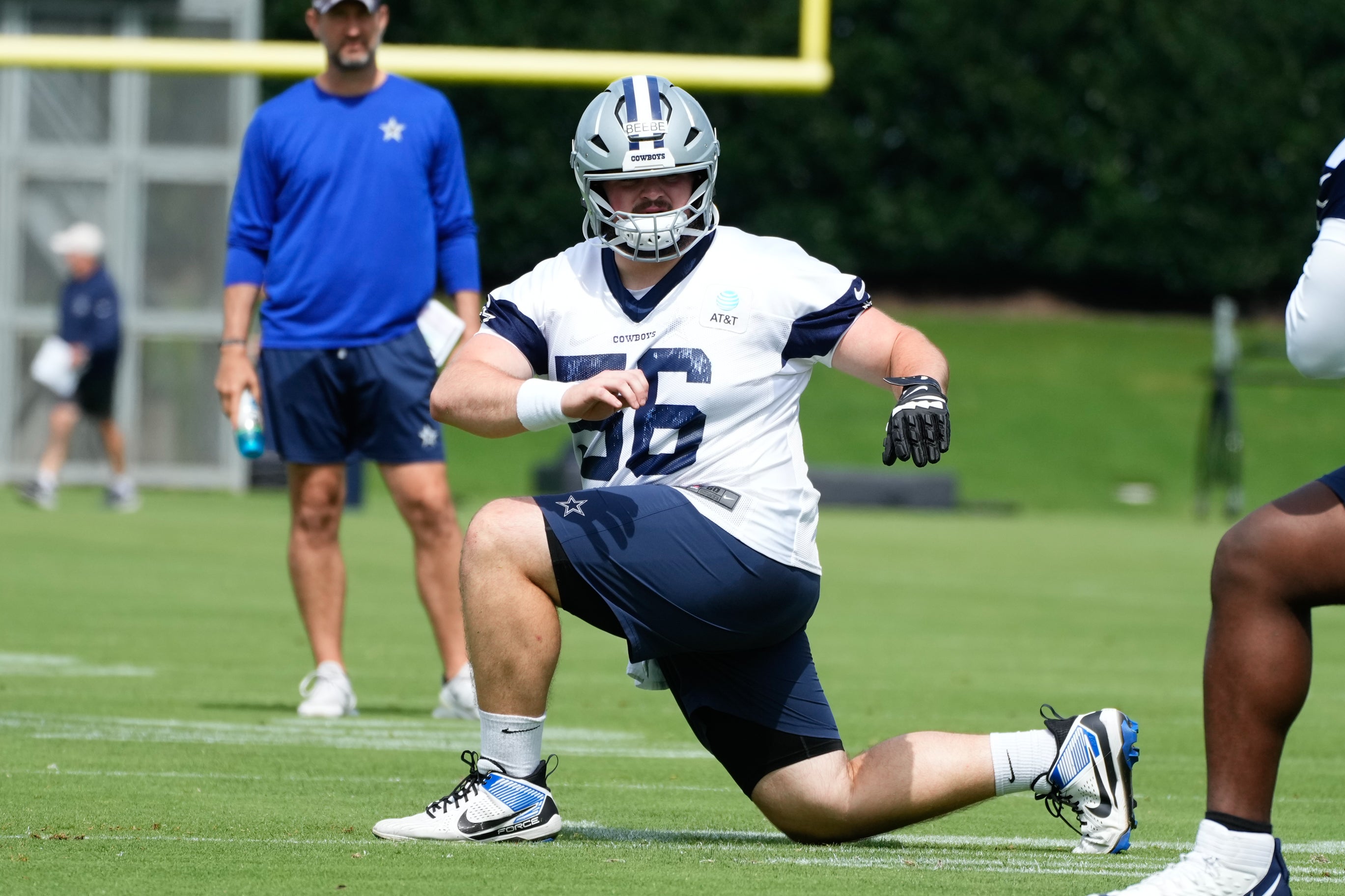 Dallas Cowboys center Cooper Beebe (56) goes through a drill during practice at the Ford Center at the Star Training Facility in Frisco, Texas.
