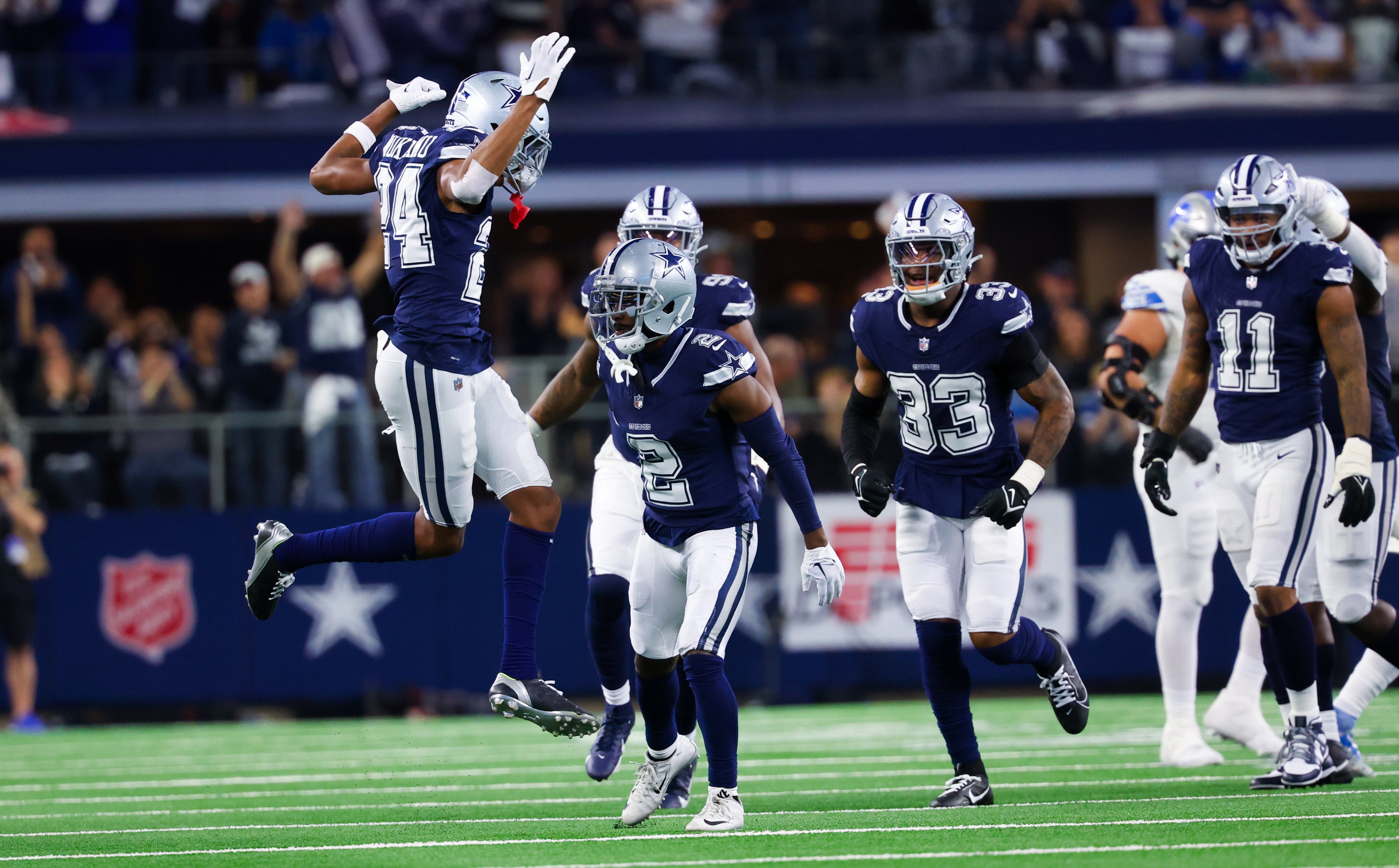 Dallas Cowboys cornerback Jourdan Lewis (2) celebrates with teammates after making an interception during the first half against the Detroit Lions at AT&T Stadium.