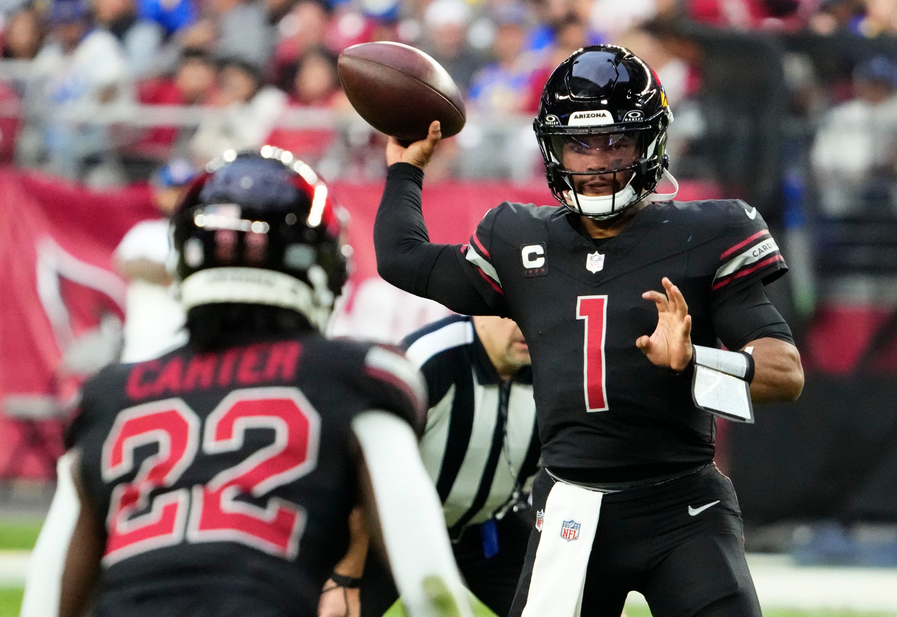 Nov 26, 2023; Glendale, AZ, USA; Arizona Cardinals quarterback Kyler Murray (1) throws a pass to running back Michael Carter (22) against the Los Angeles Rams in the second half at State Farm Stadium. Mandatory Credit: Rob Schumacher-Arizona Republic
