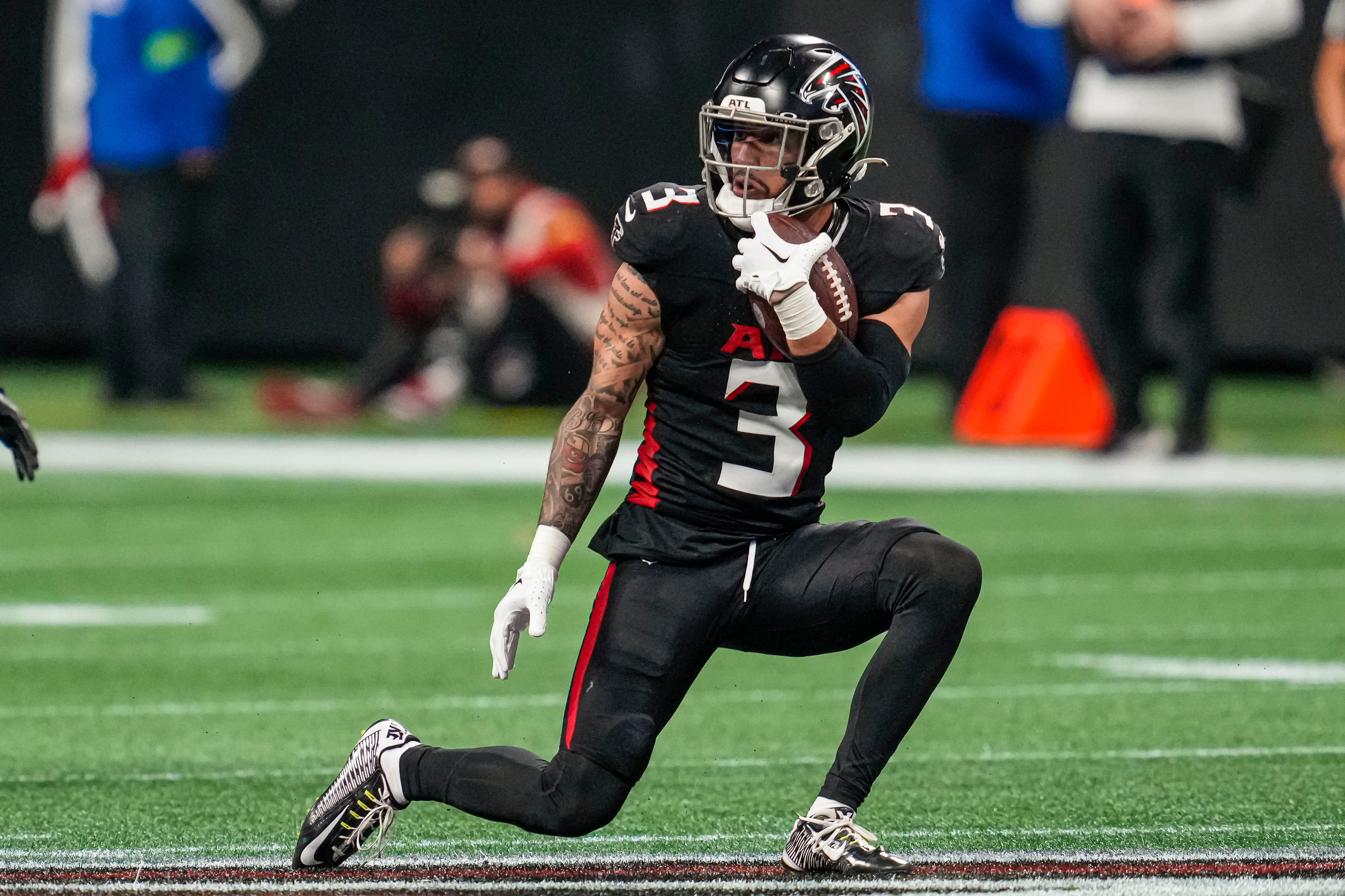 Atlanta Falcons safety Jessie Bates III (3) runs after intercepting a pass against the Indianapolis Colts during the second half at Mercedes-Benz Stadium.