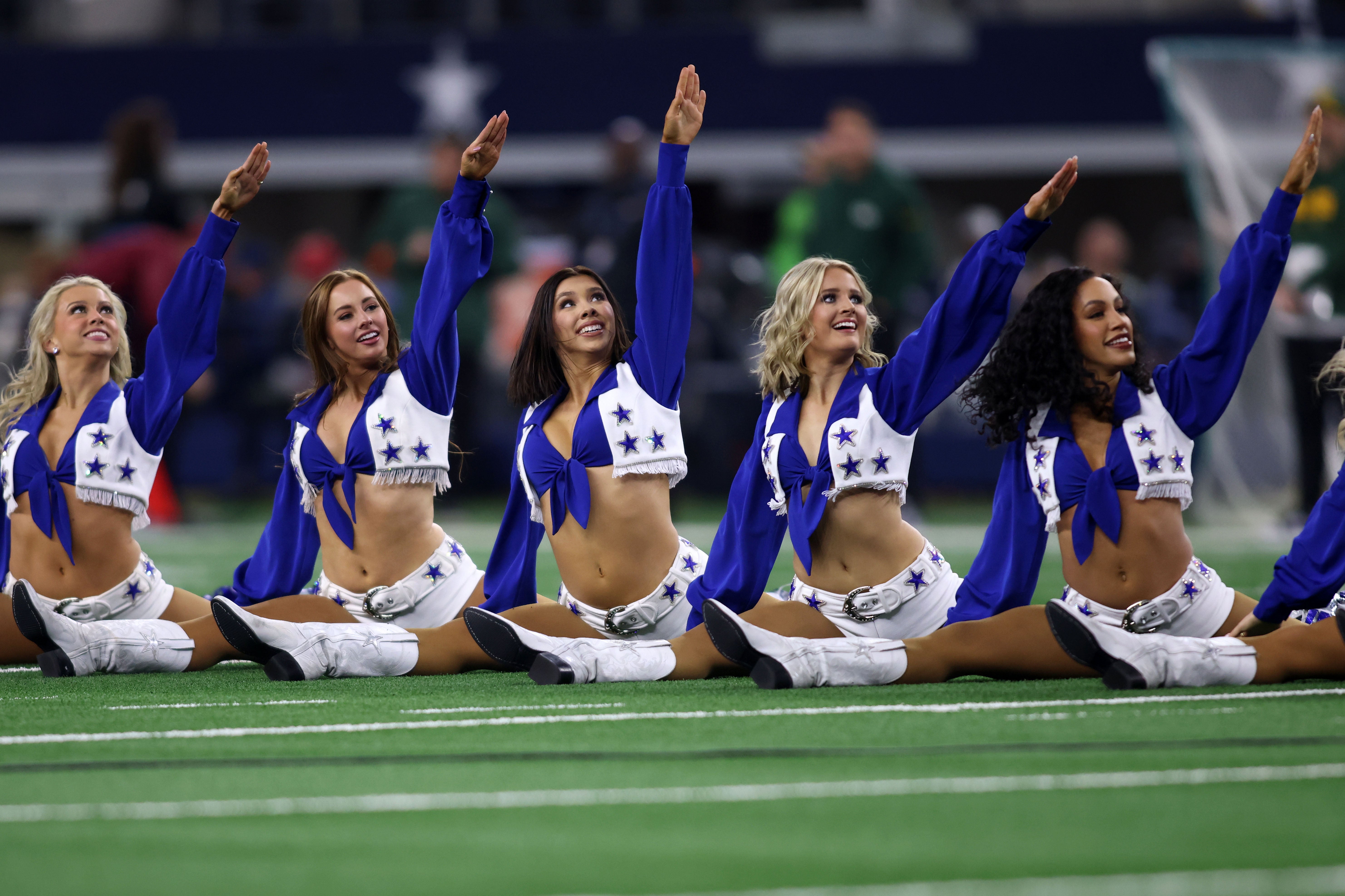 The Dallas Cowboys cheerleaders perform in a 2024 NFC wild card game against the Green Bay Packers at AT&T Stadium.