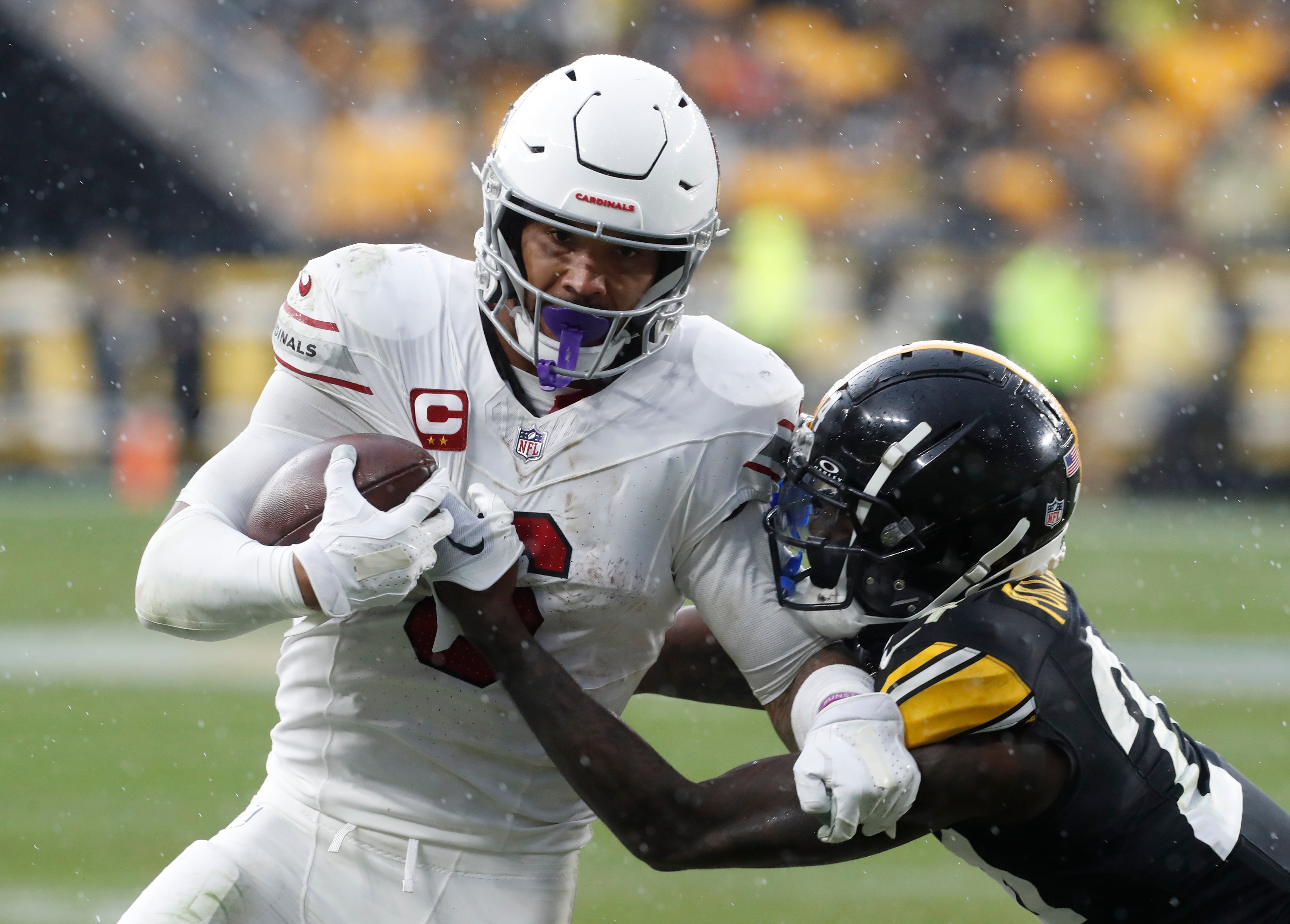 Dec 3, 2023; Pittsburgh, Pennsylvania, USA; Arizona Cardinals running back James Conner (6) carries the ball against Pittsburgh Steelers cornerback Joey Porter Jr. (24) during the third quarter at Acrisure Stadium. Mandatory Credit: Charles LeClaire-USA TODAY Sports