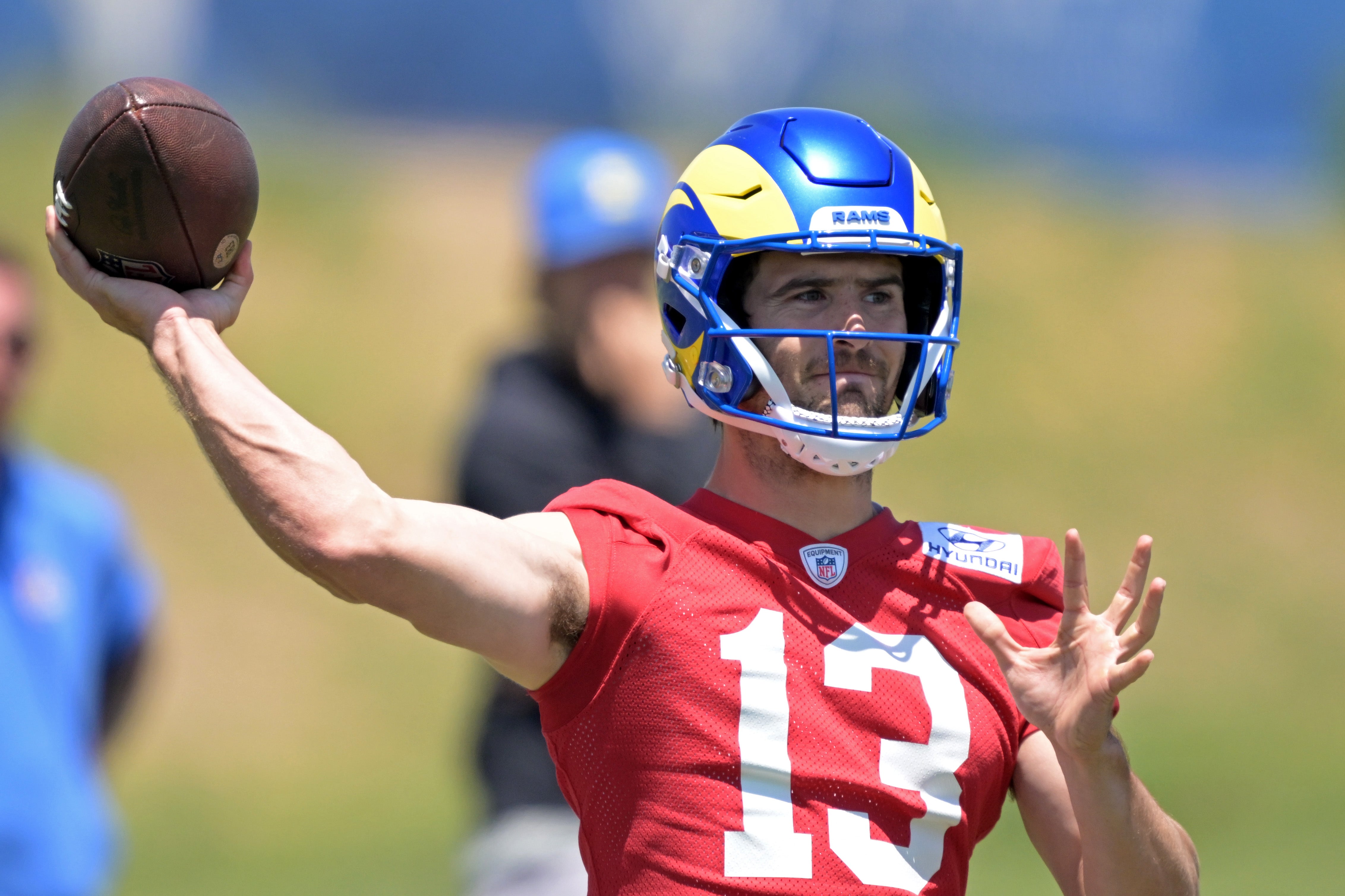 May 28, 2024; Thousand Oaks, CA, USA; Los Angeles Rams quarterback Stetson Bennett (13) throws a pass during OTAs at the team training facility at California Lutheran University. Mandatory Credit: Jayne Kamin-Oncea-USA TODAY Sports