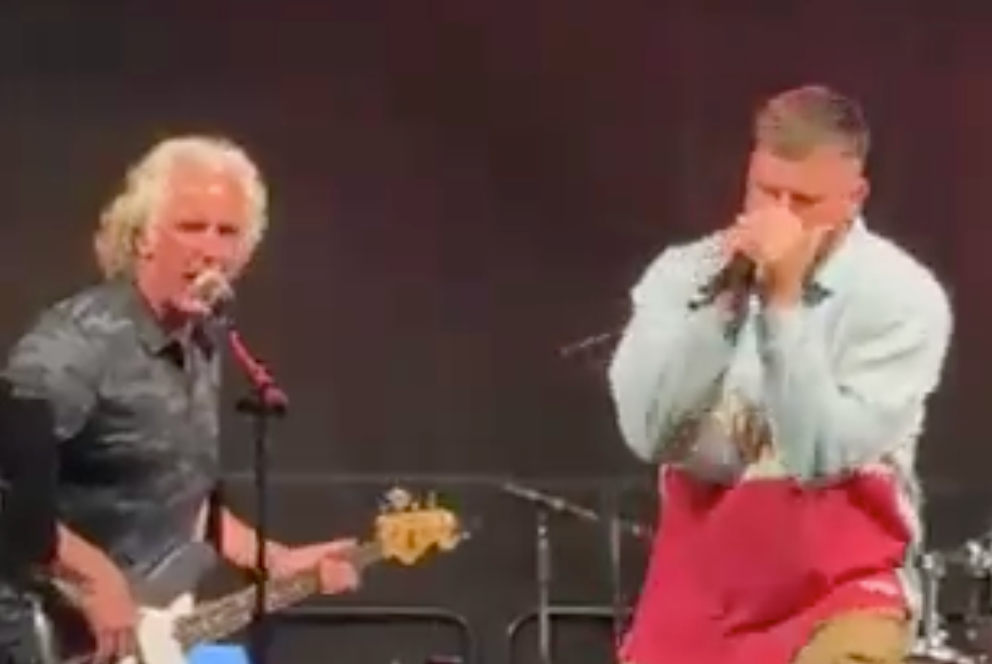 Travis Kelce sings during a karaoke event at a charity gold tournament.