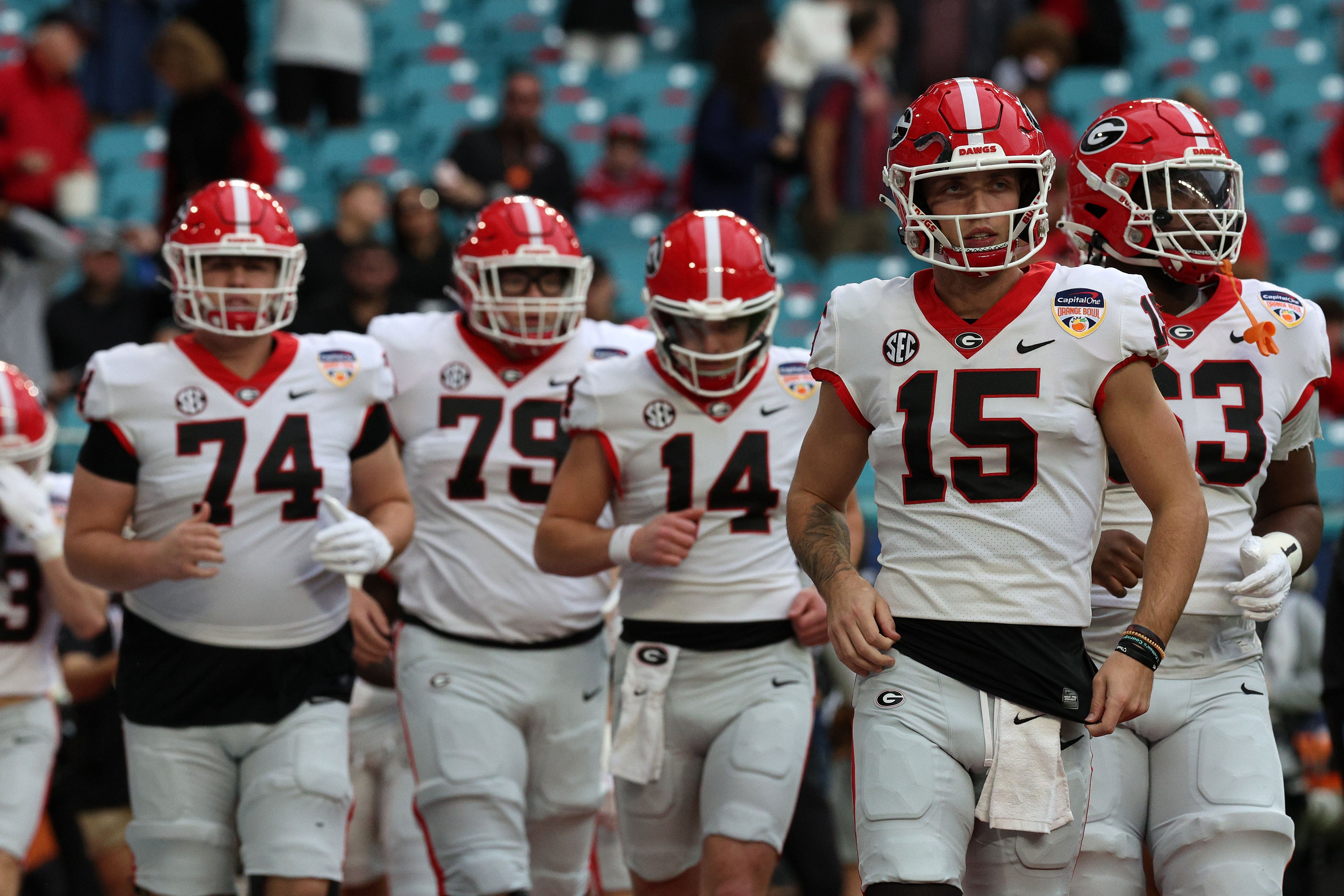 Georgia Bulldogs quarterback Carson Beck (15) takes the field before the 2023 Orange Bowl against the Florida State Seminoles at Hard Rock Stadium.