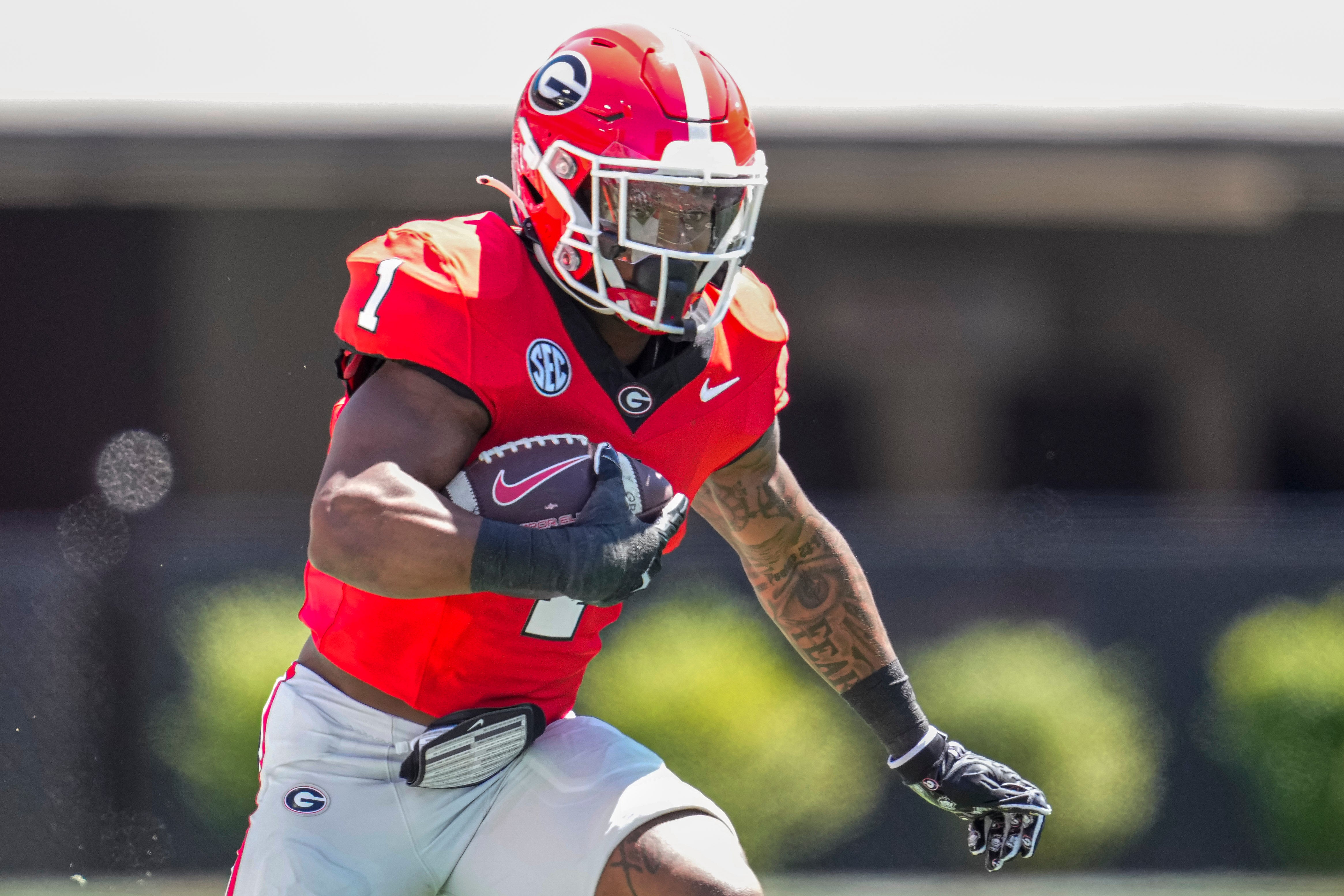 Georgia Bulldogs running back Trevor Etienne (1) runs with the ball during the G-Day Game at Sanford Stadium.