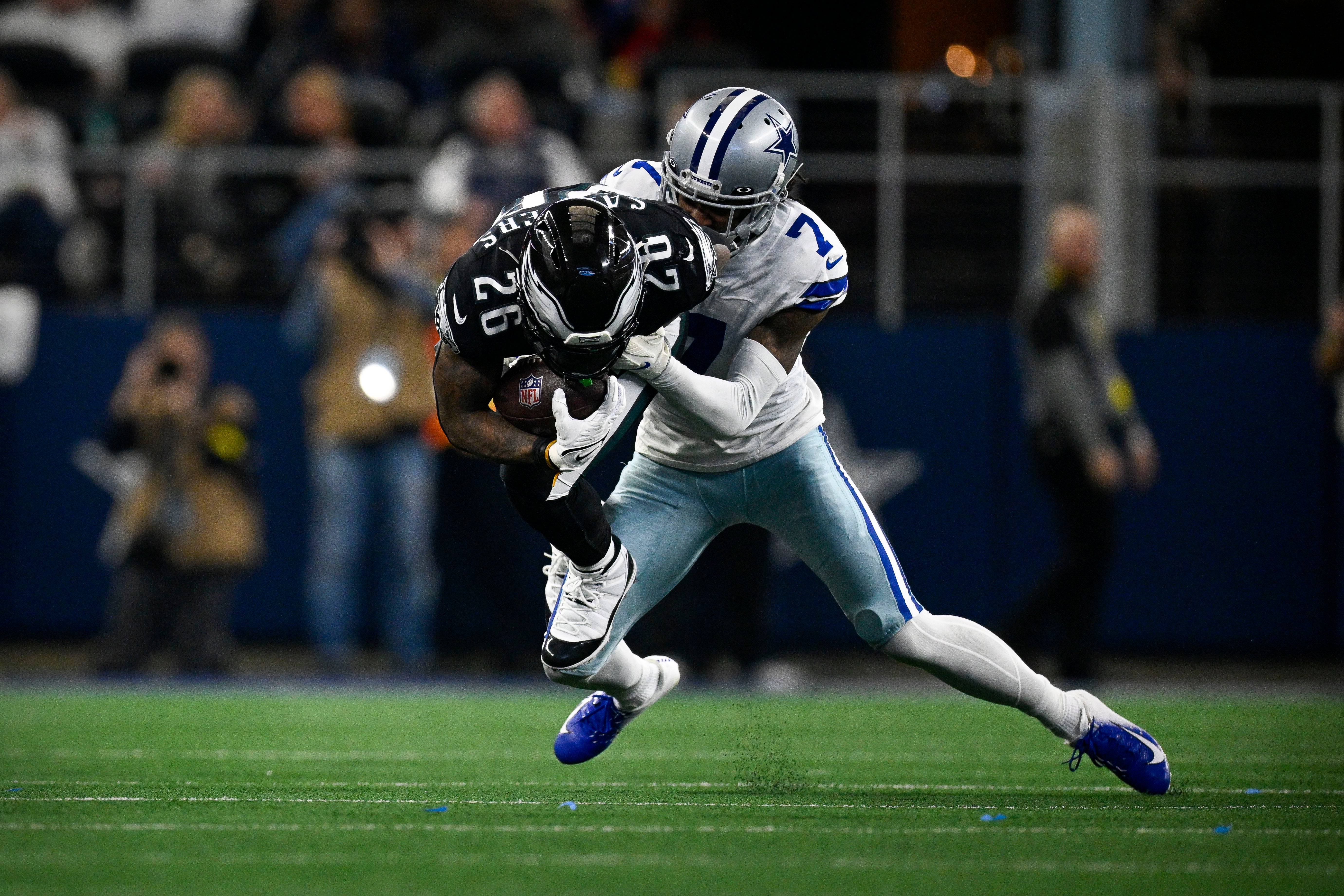 Philadelphia Eagles running back Miles Sanders (26) and Dallas Cowboys cornerback Trevon Diggs (7) in action during the game between the Dallas Cowboys and the Philadelphia Eagles at AT&T Stadium.