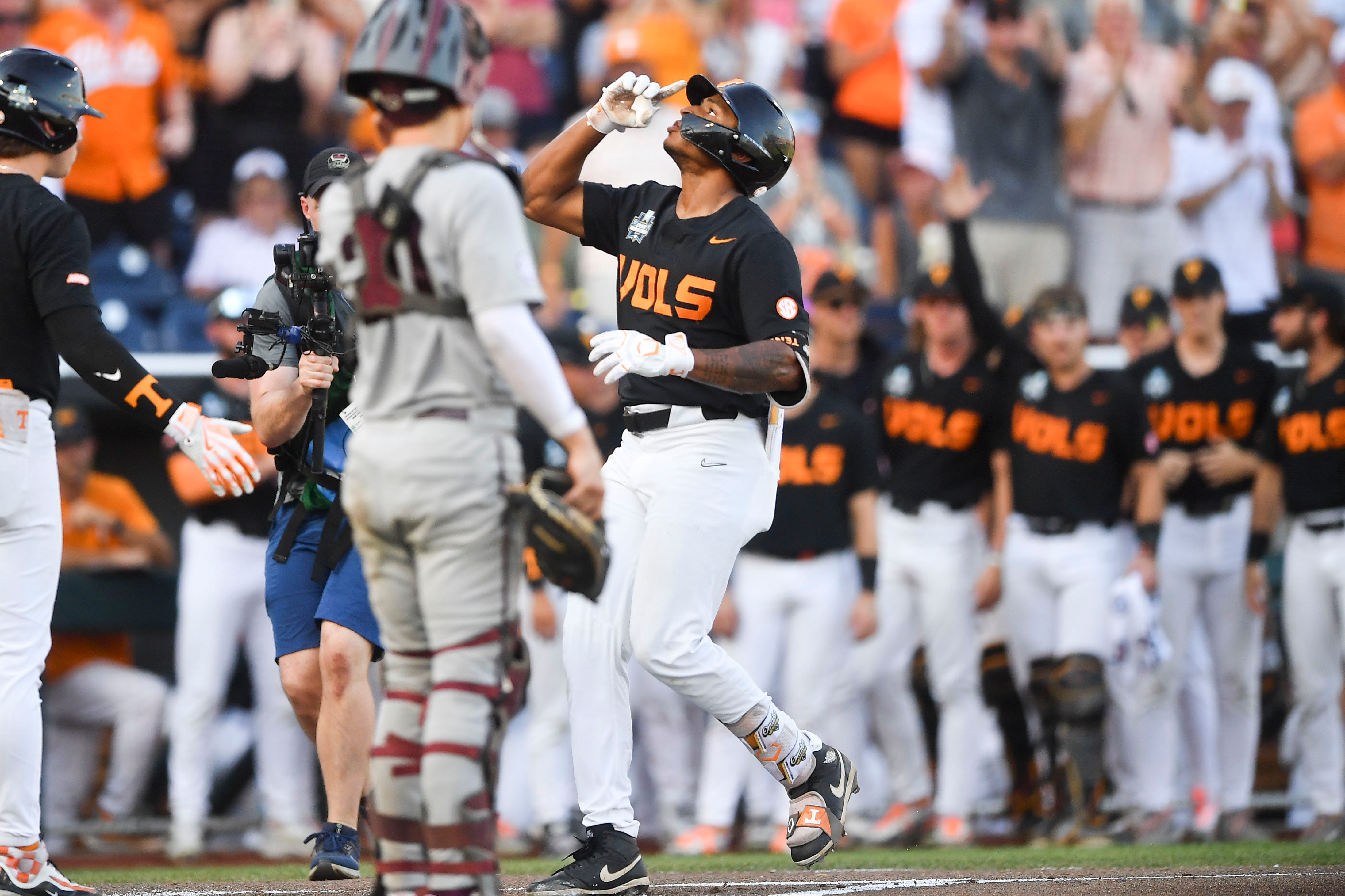 Tennessee's Christian Moore (1) celebrates while running the bases after hitting a home run during game three of the NCAA College World Series finals between Tennessee and Texas A&M at Charles Schwab Field in Omaha, Neb., on Monday, June 24, 2024.