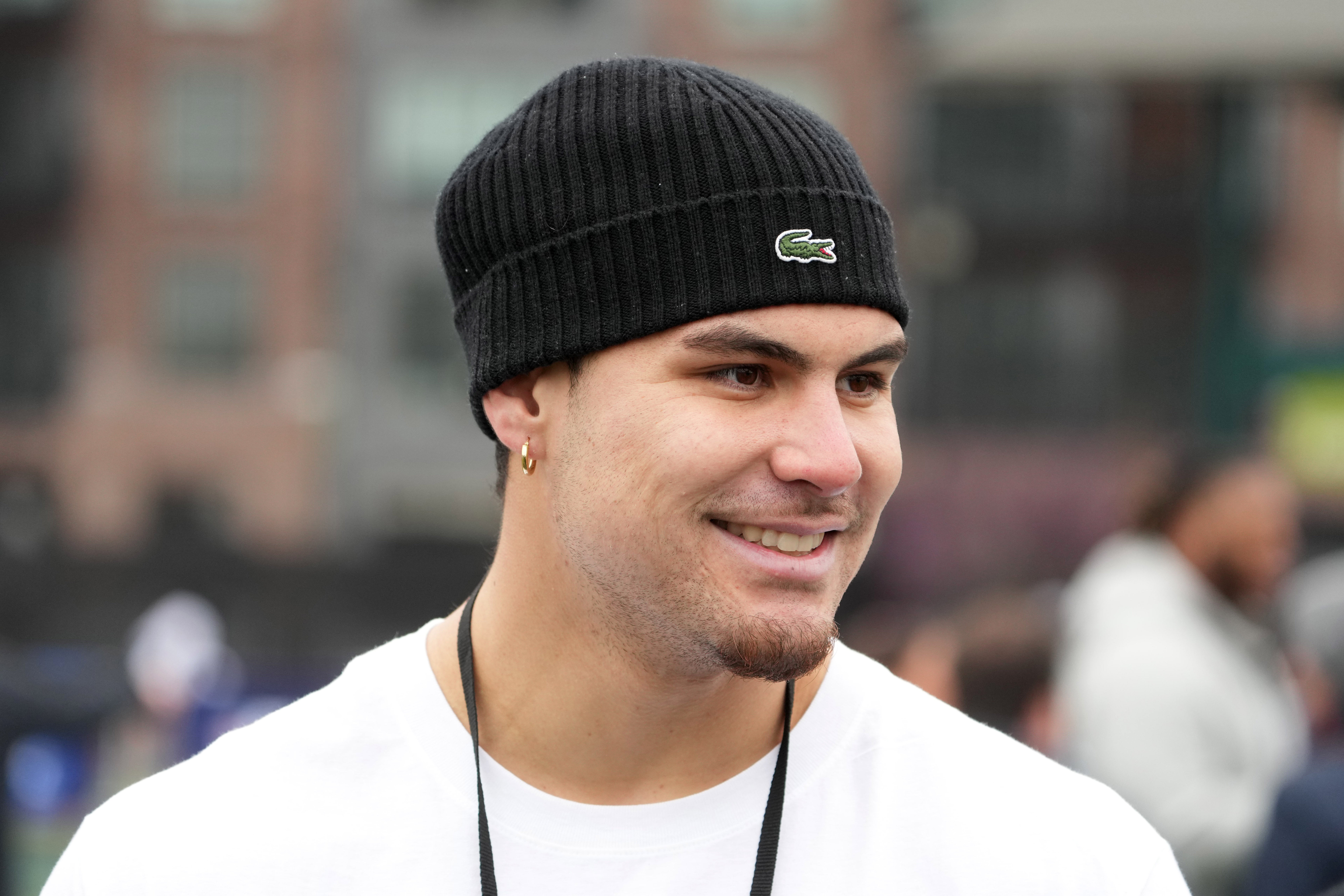 Apr 24, 2024; Detroit, MI, USA; UCLA Bruins defensive lineman Laiatu Latu reacts at the Play Football Prospect Clinic at The Corner Ballpark.