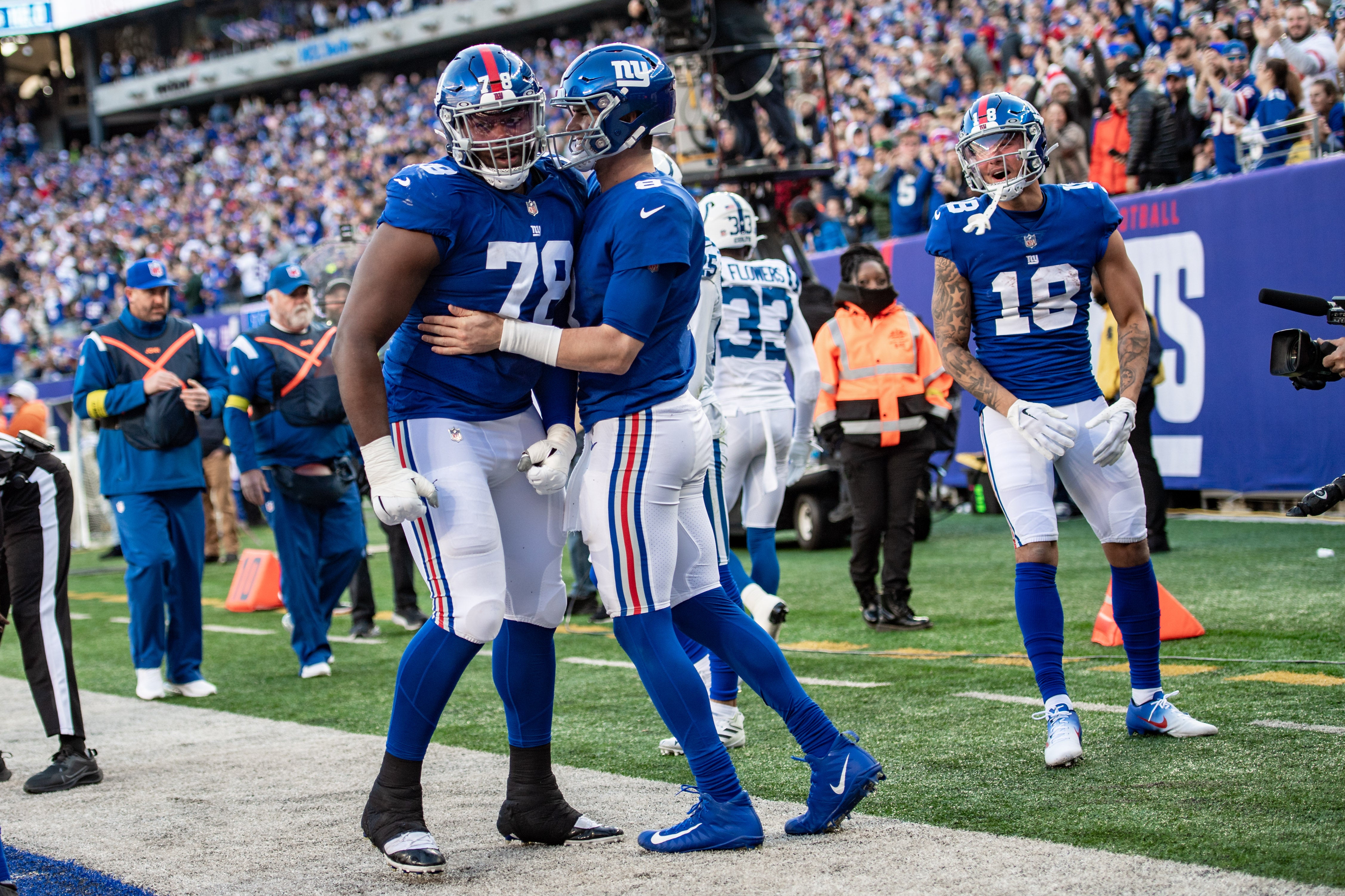 New York Giants quarterback Daniel Jones (8) celebrates with New York Giants offensive tackle Andrew Thomas (78) after rushing for a touchdown against the Indianapolis Colts during the second half at MetLife Stadium.