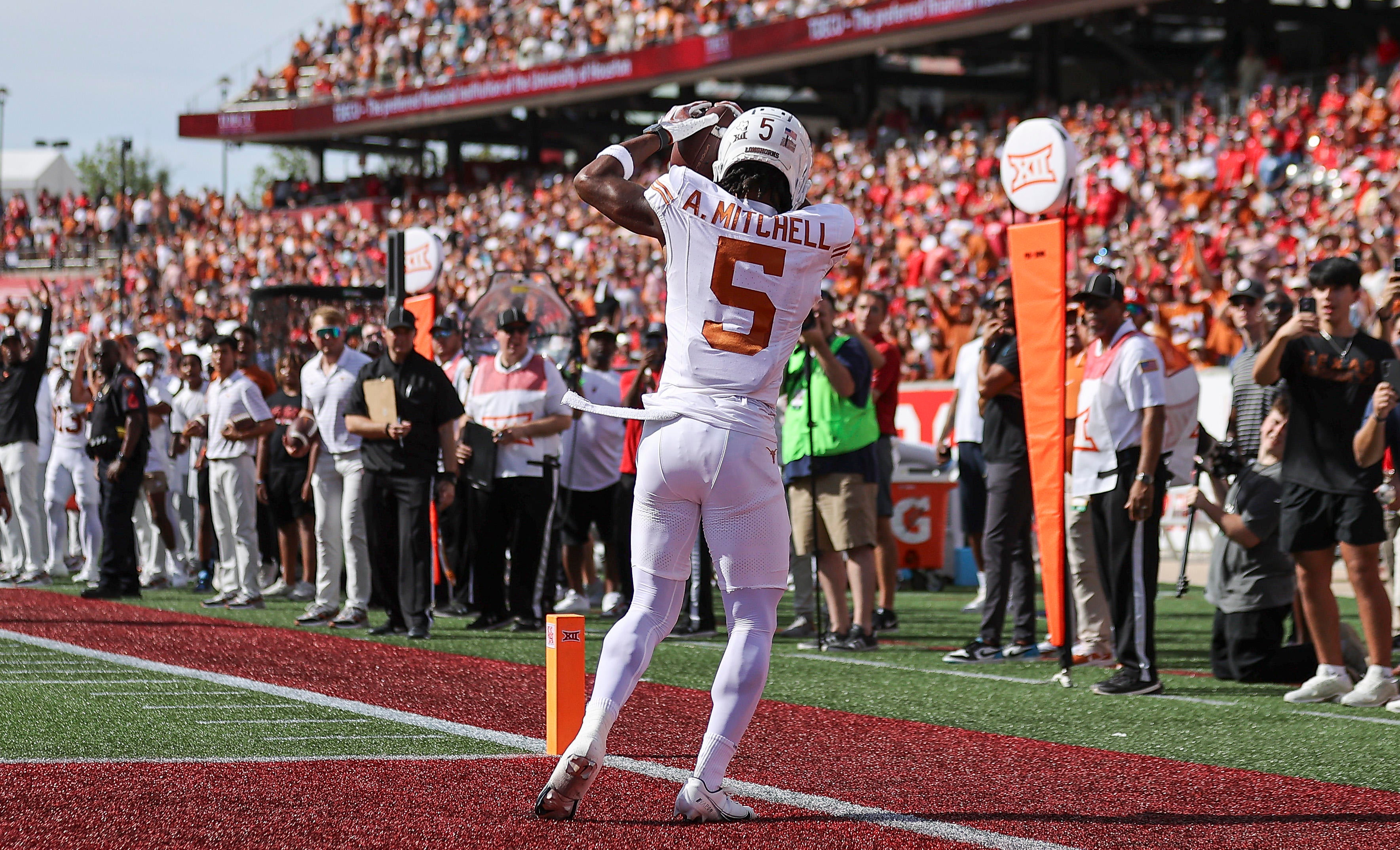 Oct 21, 2023; Houston, Texas, USA; Texas Longhorns wide receiver Adonai Mitchell (5) makes a reception for a touchdown during the first quarter against the Houston Cougars at TDECU Stadium.