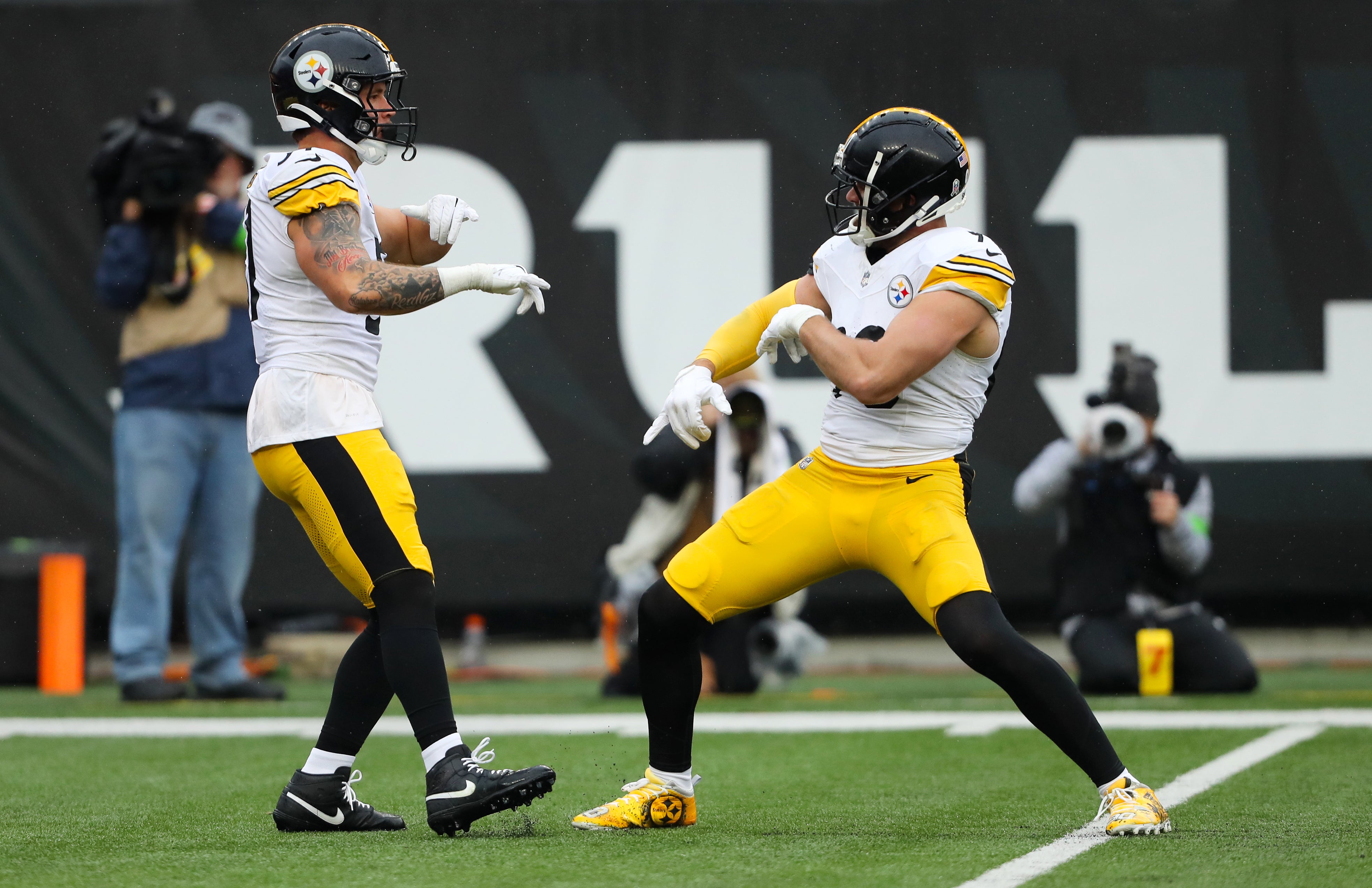 Nov 26, 2023; Cincinnati, Ohio, USA; Pittsburgh Steelers linebacker Nick Herbig (left) and linebacker T.J. Watt (right) celebrate after a sack during the second quarter against the Cincinnati Bengals at Paycor Stadium. Mandatory Credit: Joseph Maiorana-USA TODAY Sports