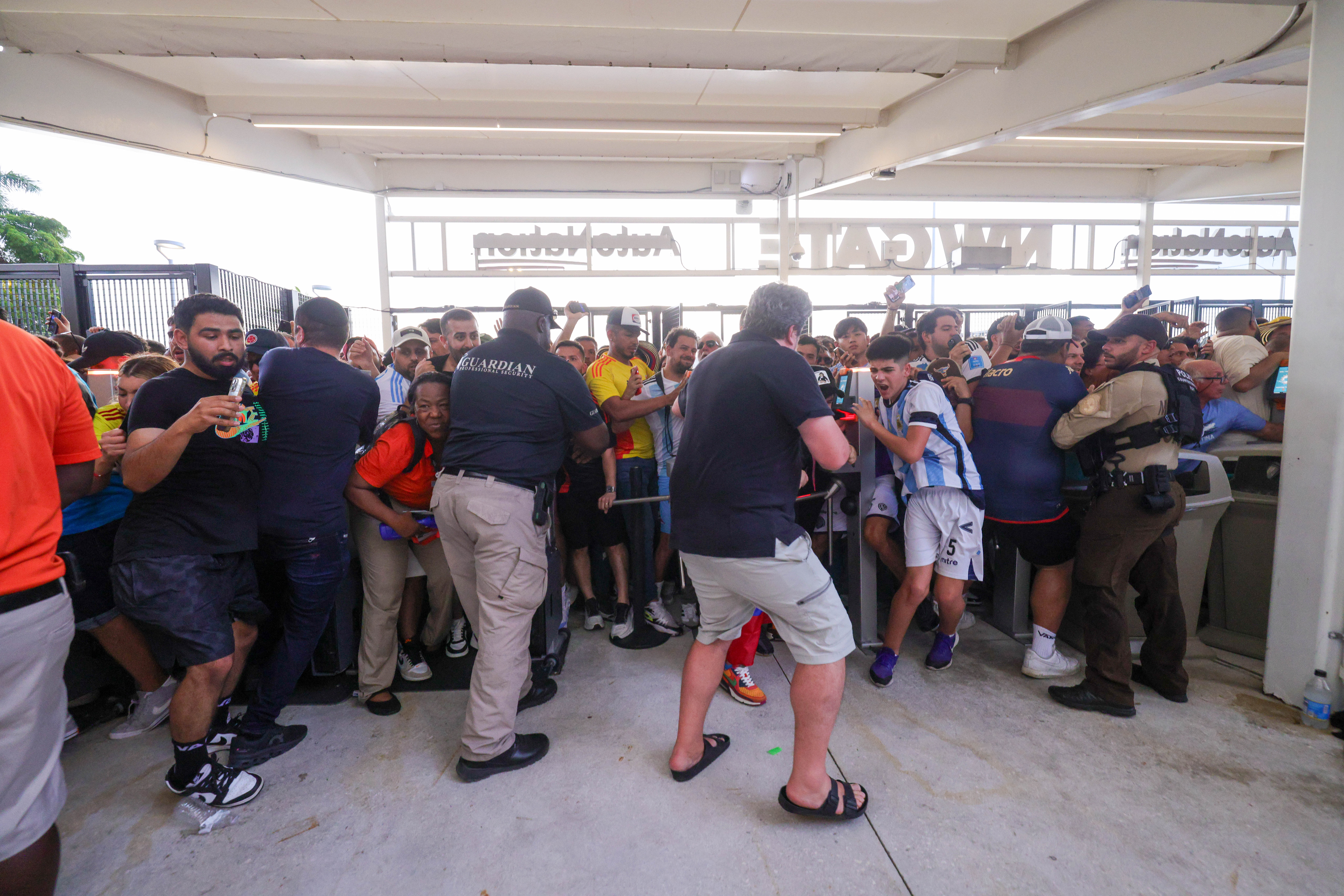 Jul 14, 2024; Miami, FL, USA; fans rush the gates before the Copa America Final match between Argentina and Colombia at Hard Rock Stadium.