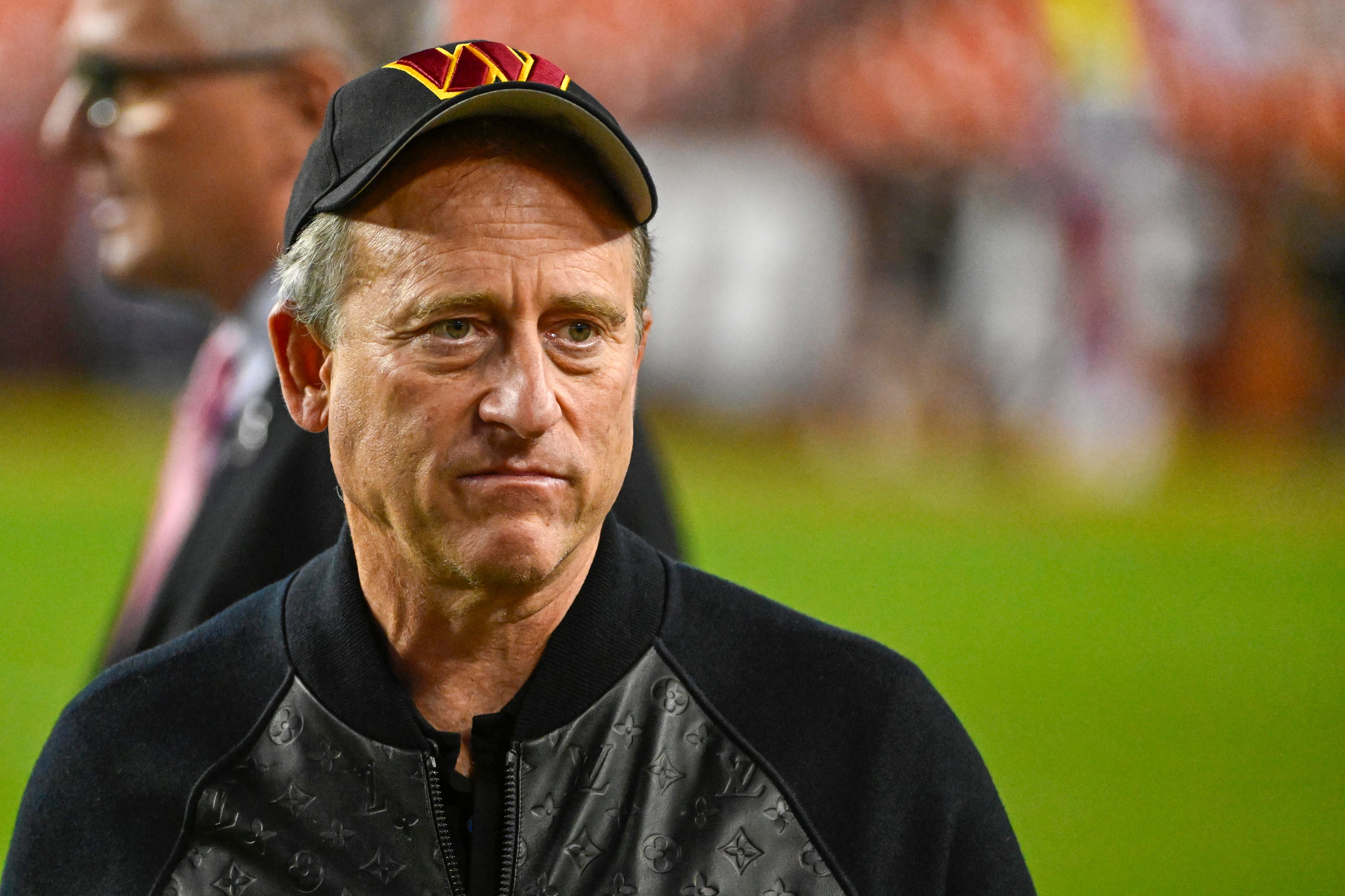 Washington Commanders owner Josh Harris on the field before the game against the Chicago Bears at FedExField.