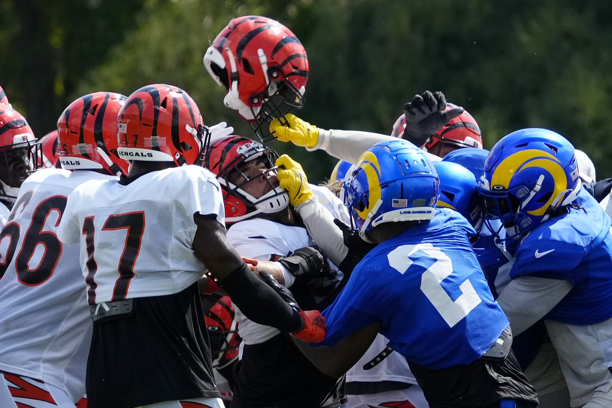 A third scuffle escalates into a brawl during a joint preseason camp practice between the Cincinnati Bengals and the Los Angeles Rams at Paycor Stadium in Cincinnati on Thursday, Aug. 25, 2022. Practice was ended early after a third scuffle turned into a broader fight between players on both teams. Cincinnati Bengals Los Angeles Rams Training Camp