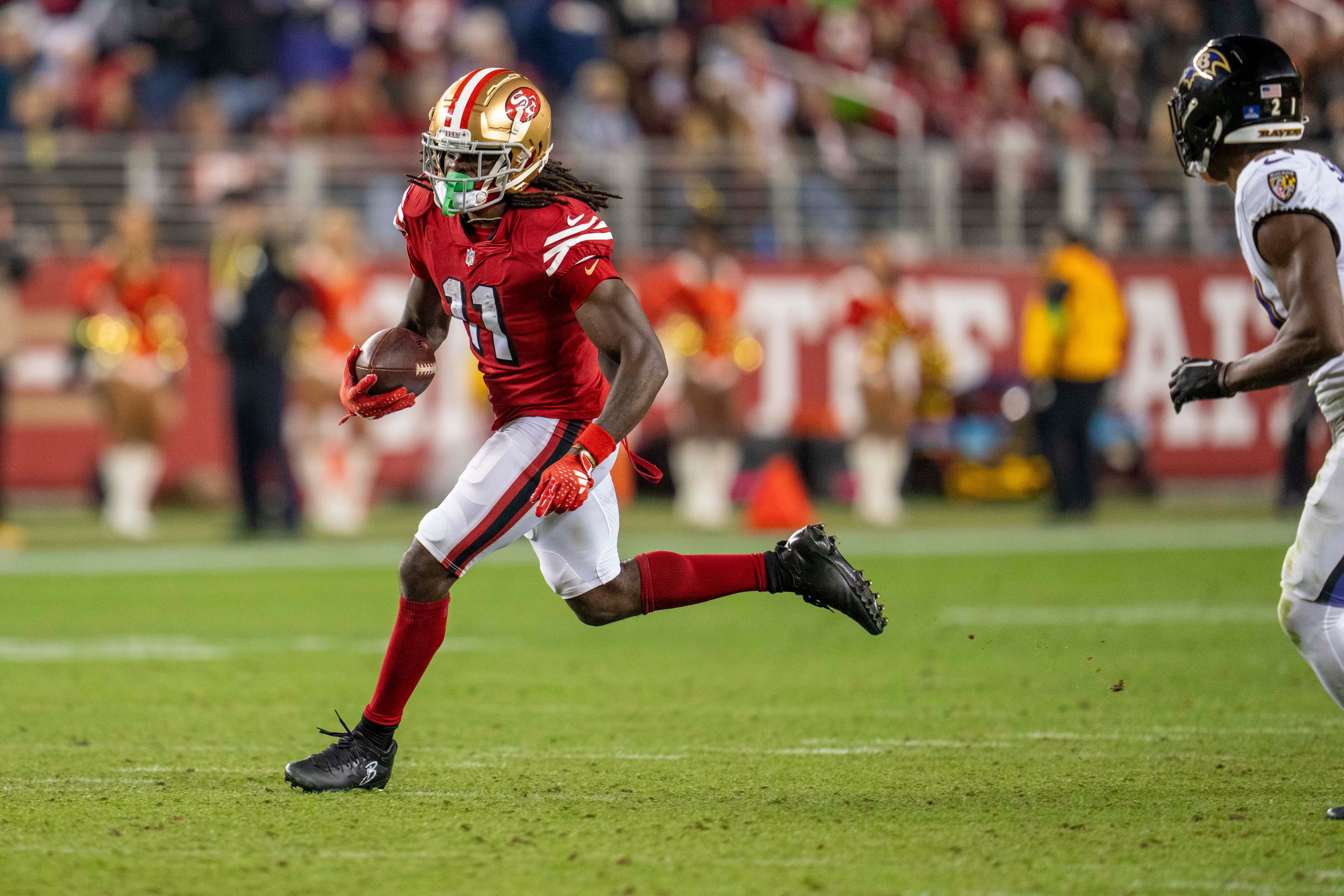 Dec 25, 2023; Santa Clara, California, USA; San Francisco 49ers wide receiver Brandon Aiyuk (11) rushes with the ball during the fourth quarter against the Baltimore Ravens at Levi's Stadium.
