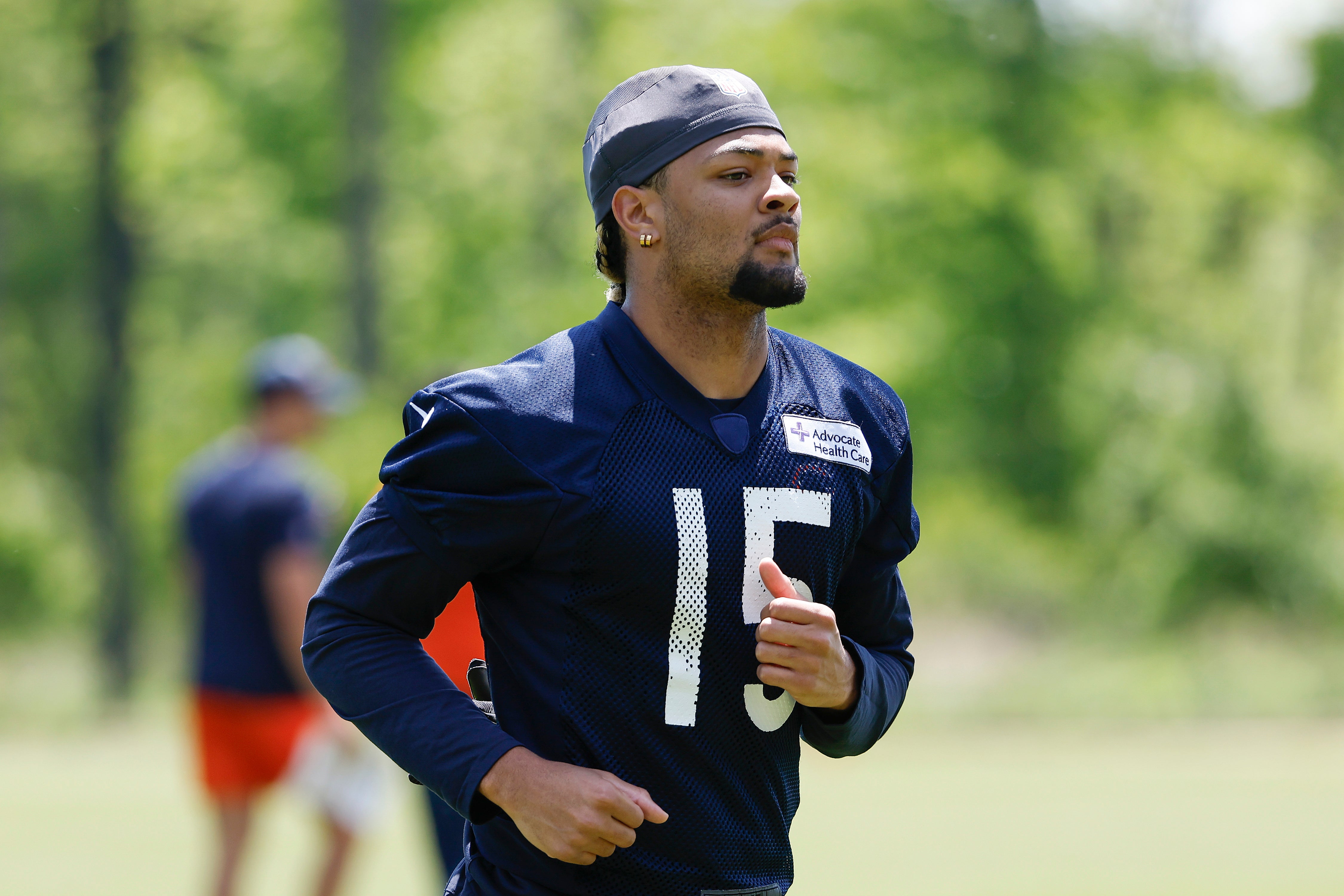 May 23, 2024; Lake Forest, IL, USA; Chicago Bears wide receiver Rome Odunze (15) warms up during organized team activities at Halas Hall.