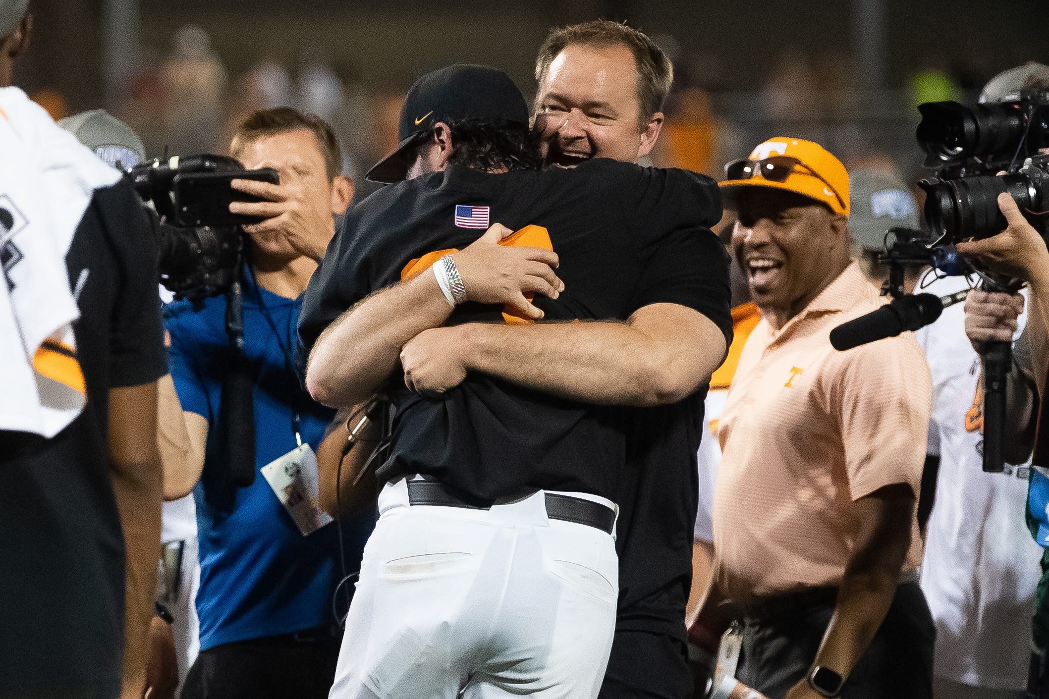 Tennessee football head coach Josh Heupel hugs Tennessee head coach Tony Vitello after game three of the NCAA College World Series finals between Tennessee and Texas A&M at Charles Schwab Field in Omaha, Neb., on Monday, June 24, 2024.