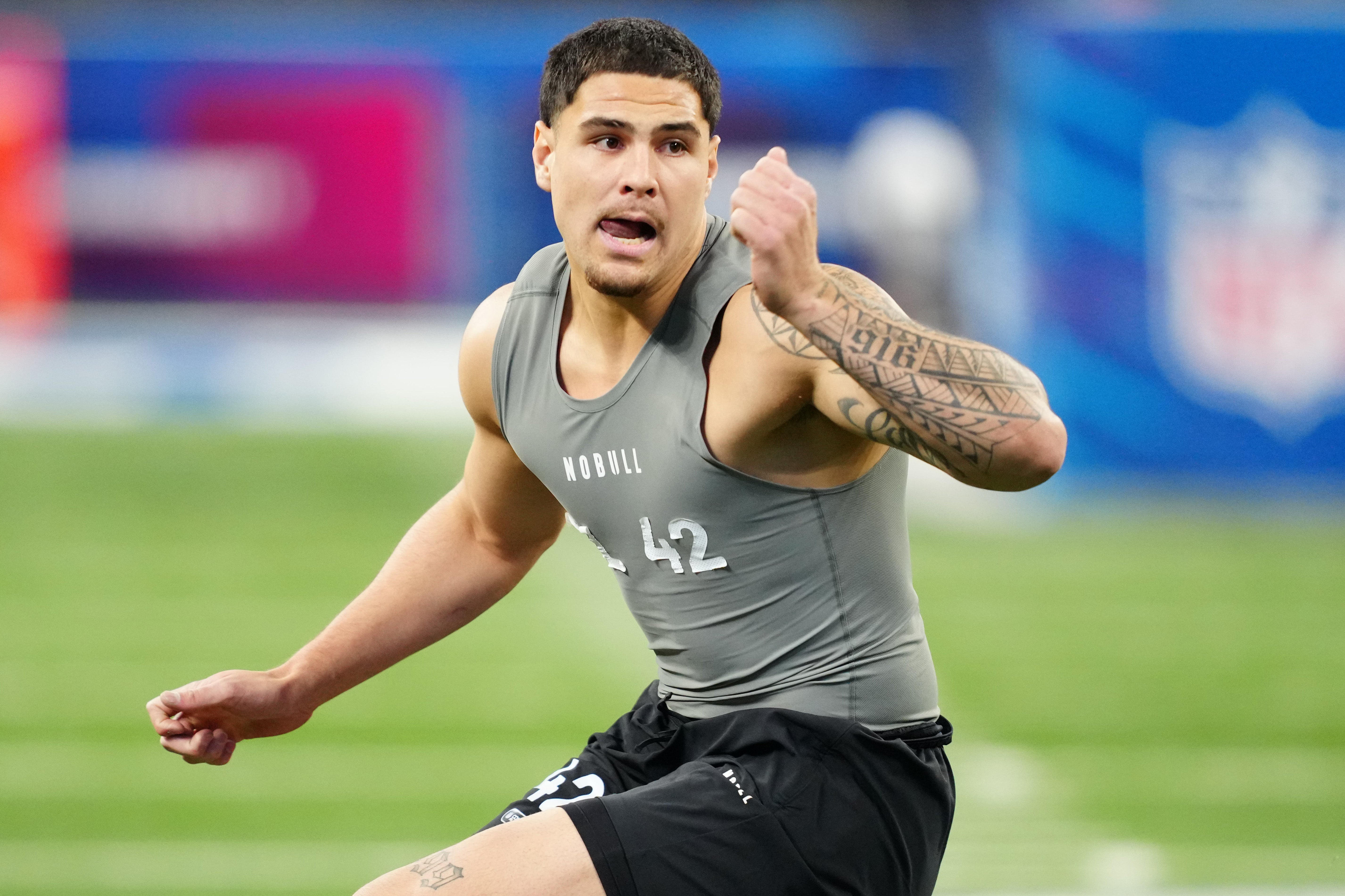 Feb 29, 2024; Indianapolis, IN, USA; UCLA defensive lineman Laiatu Latu (DL42) works out during the 2024 NFL Combine at Lucas Oil Stadium.
