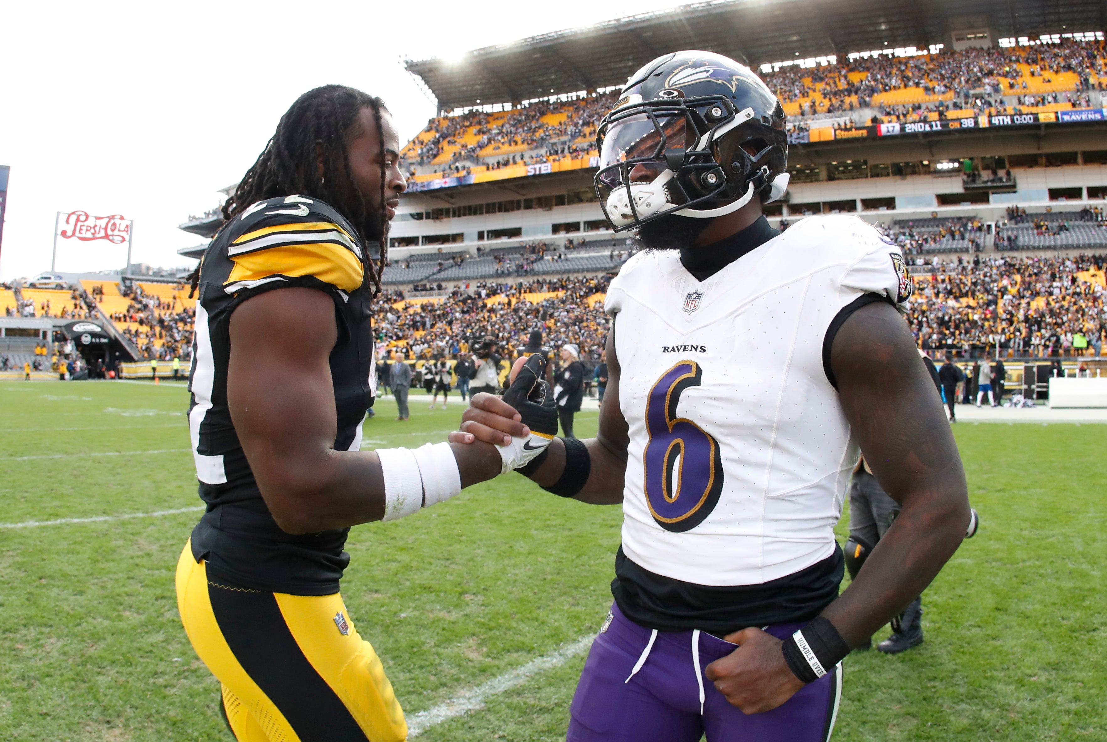 Oct 8, 2023; Pittsburgh, Pennsylvania, USA; Pittsburgh Steelers running back Najee Harris (22) and Baltimore Ravens linebacker Patrick Queen (6) shake hands after their game at Acrisure Stadium. Pittsburgh won 17-10. Mandatory Credit: Charles LeClaire-USA TODAY Sports