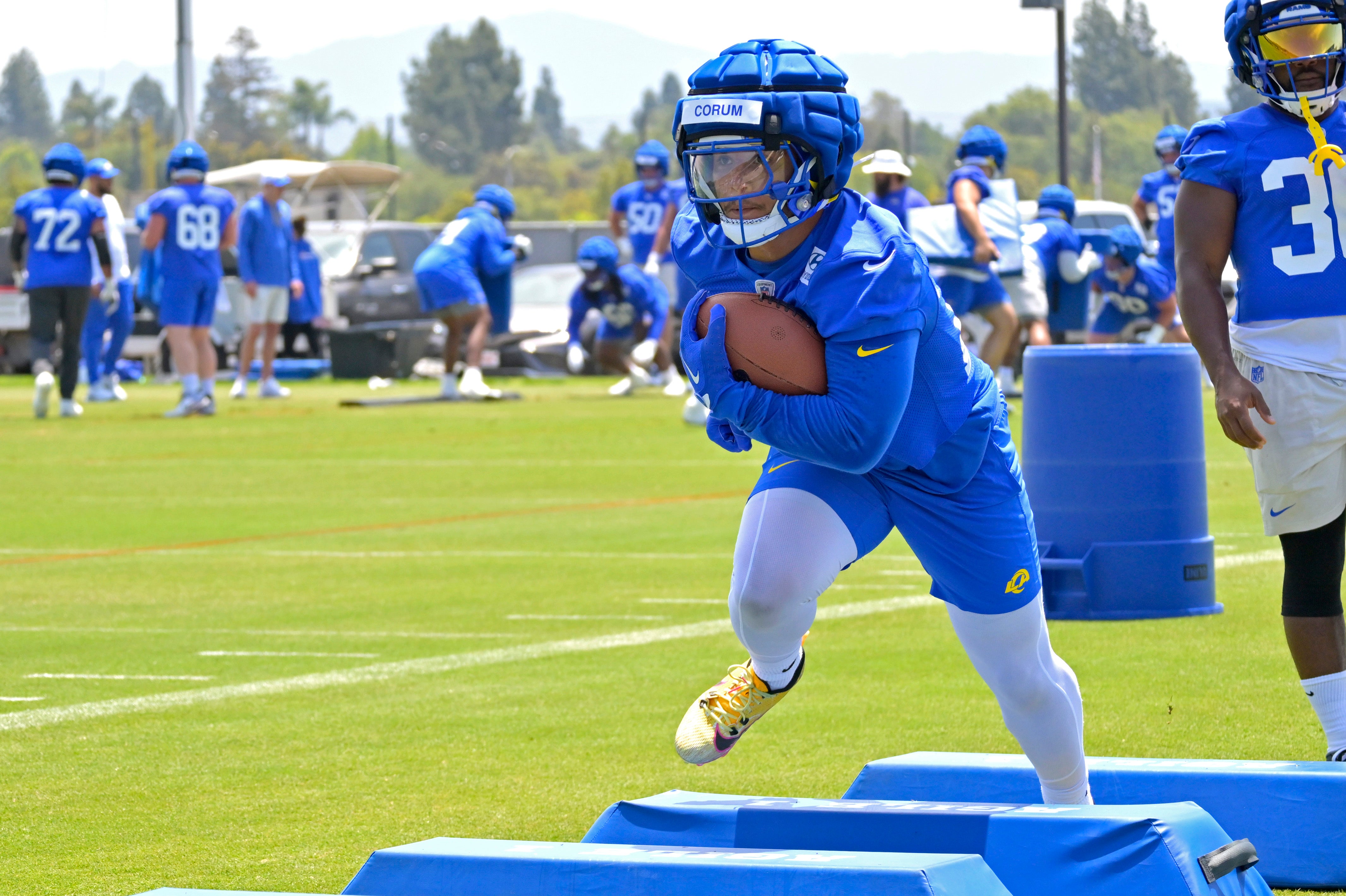 May 28, 2024; Thousand Oaks, CA, USA; Los Angeles Rams running back Blake Corum (22) participates in drills during OTAs at the team training facility at California Lutheran University. Mandatory Credit: Jayne Kamin-Oncea-USA TODAY Sports