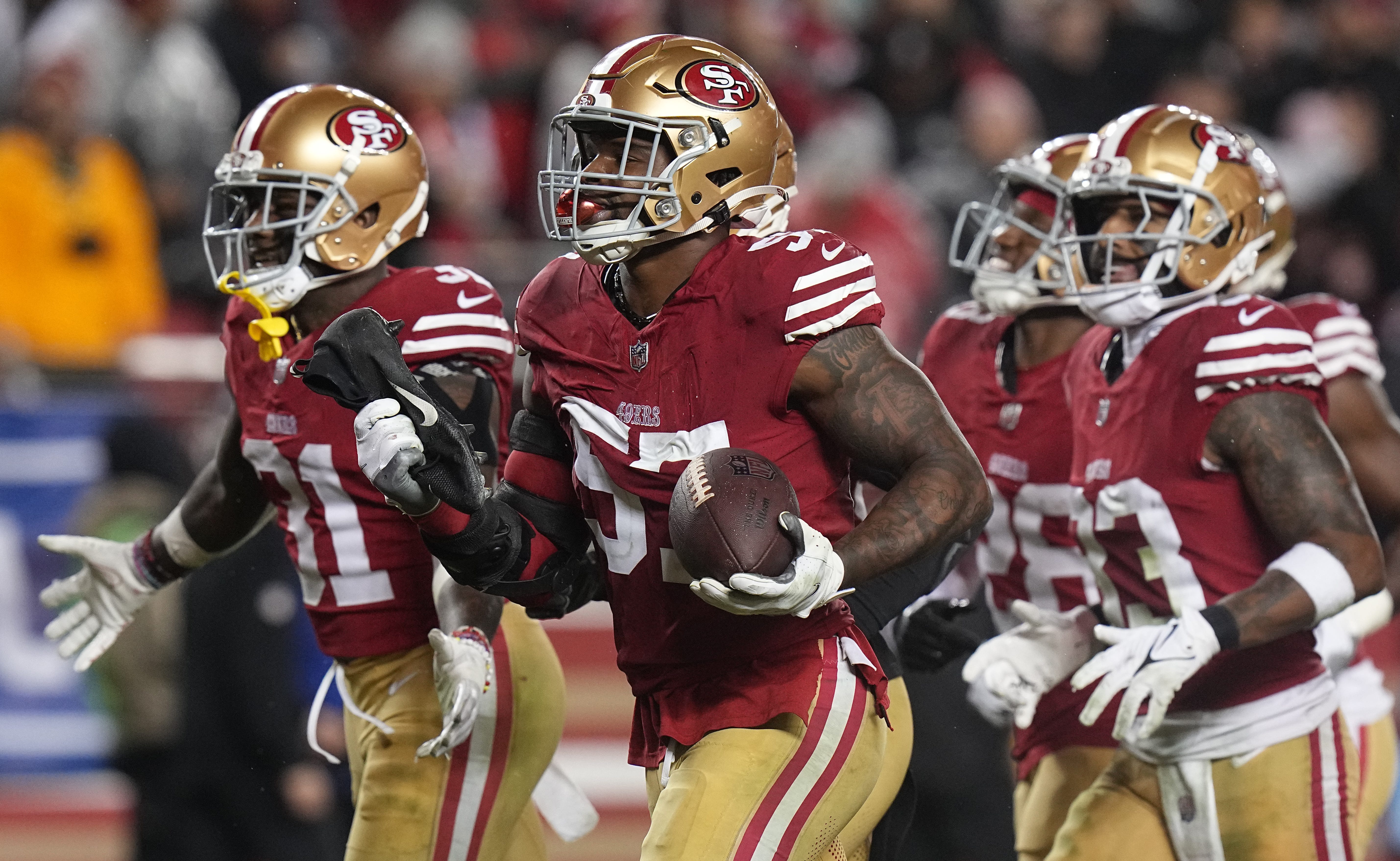 San Francisco 49ers linebacker Dre Greenlaw (57) celebrates his interception during the third quarter of their NFC divisional playoff game Saturday, January 20, 2024 at Levi Stadium in Santa Clara, California. The San Francisco 49ers beat the Green Bay Packers 24-21.