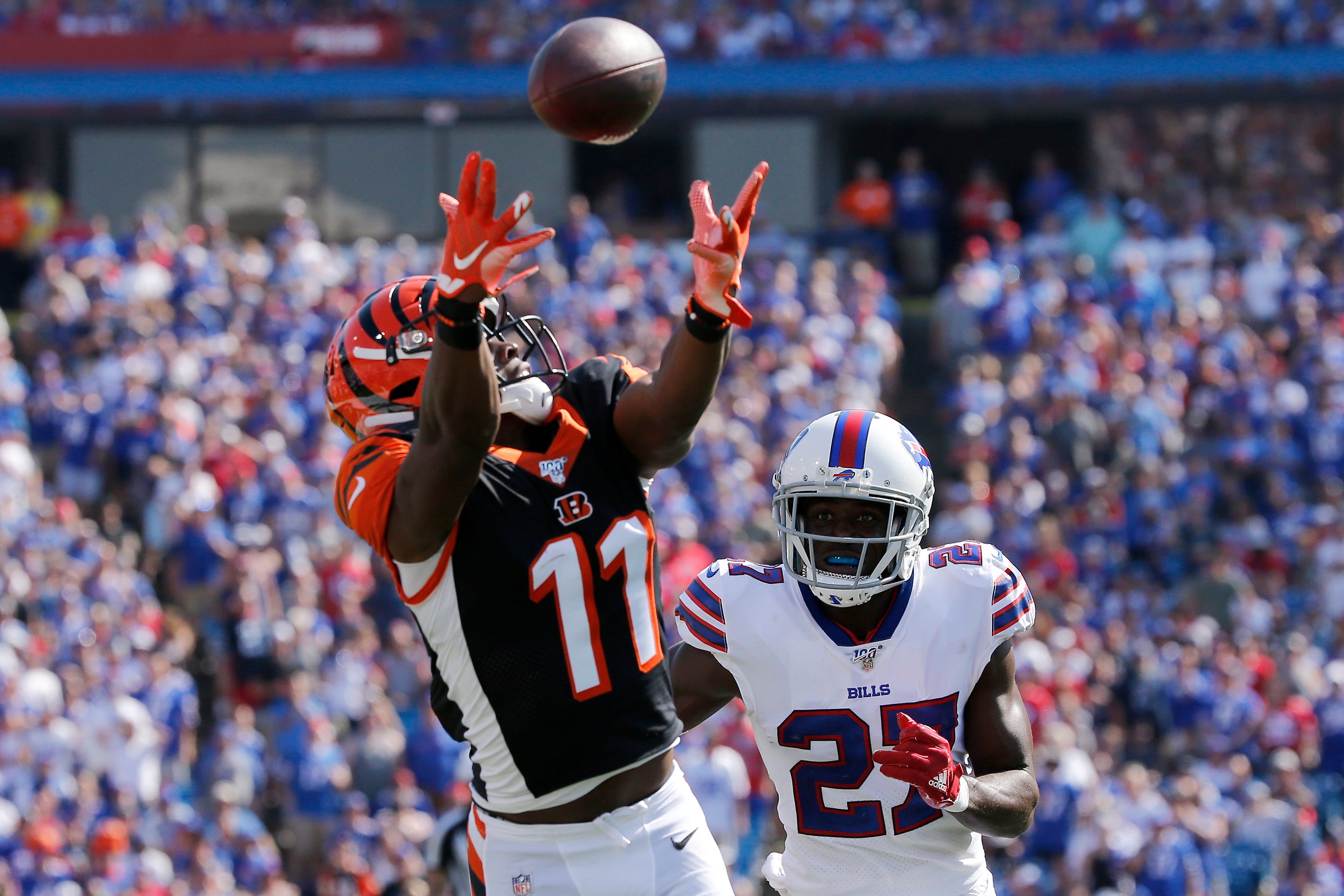 Cincinnati Bengals wide receiver John Ross (11) is unable to catch up to a deep pass under pressure from Buffalo Bills cornerback Tre'Davious White (27) in the second quarter of the NFL Week 3 game be.