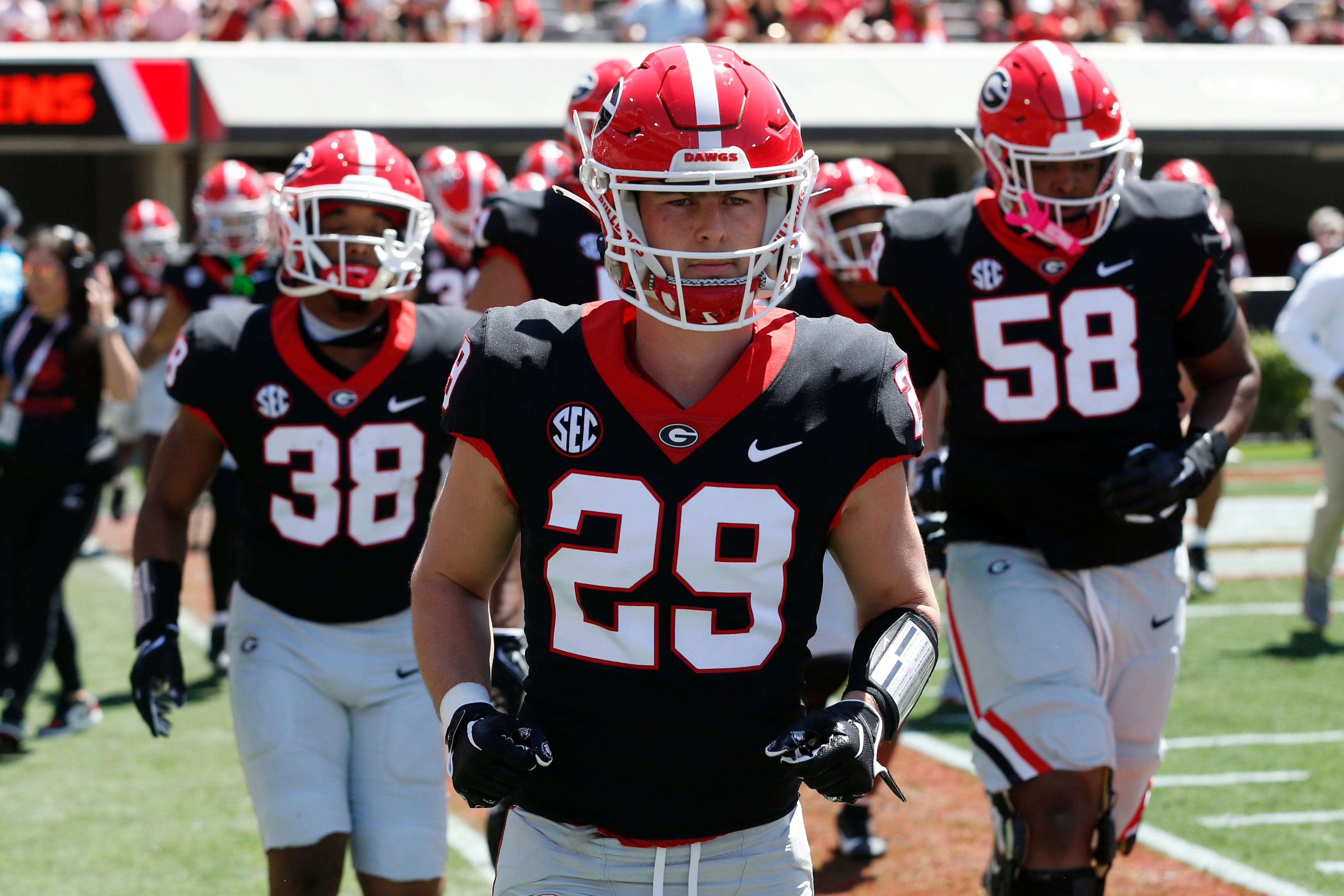 The Black team takes the field before the start of the G-Day spring football game in Athens, Ga., on Saturday, April 13, 2024.