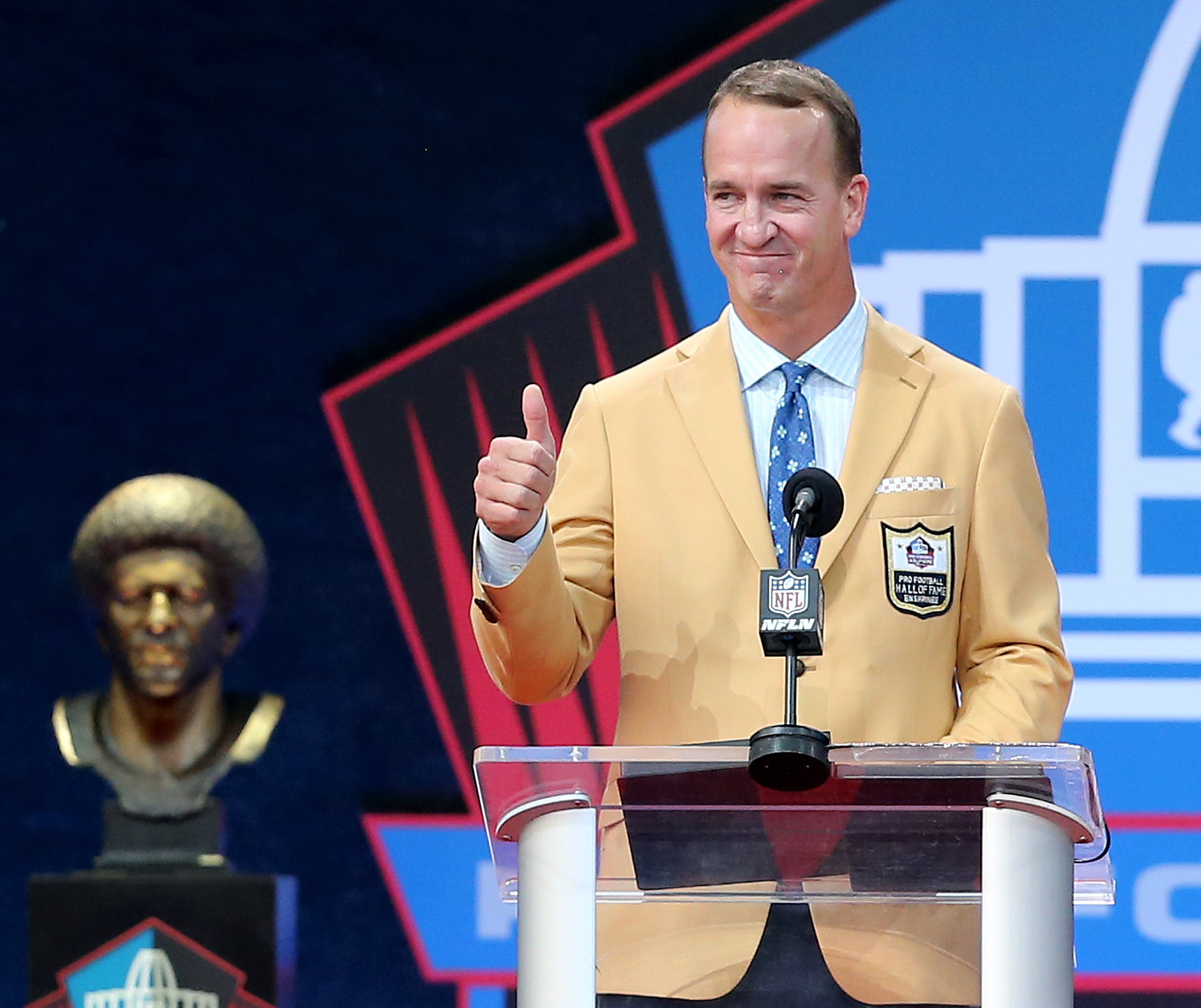 Peyton Manning was enshrined in the Pro Football Hall of Fame at Tom Benson Hall of Fame Stadium on Sunday, August 8, 2021. Manning was presented by father Archie Manning.