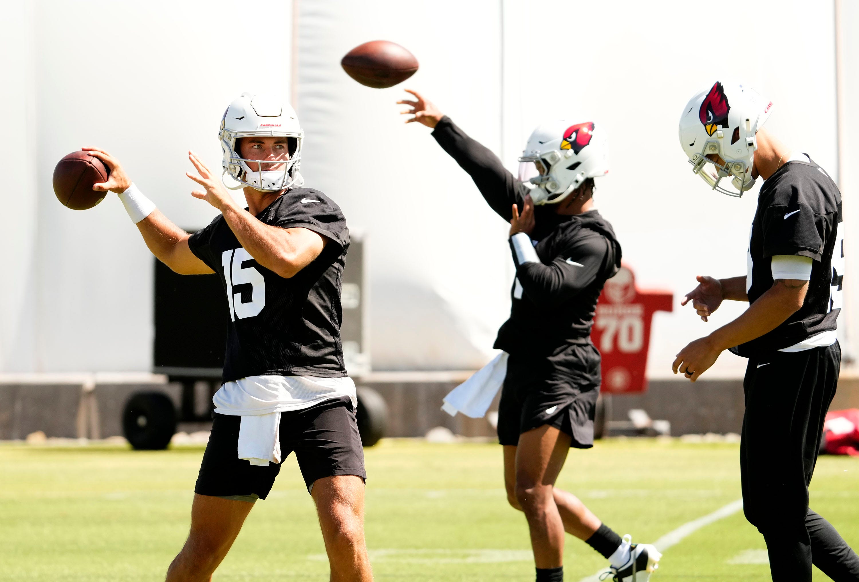 Arizona Cardinals quarterbacks Clayton Tune (15) and Kyler Murray (background) during minicamp at Dignity Health Training Center on June 11, 2024.