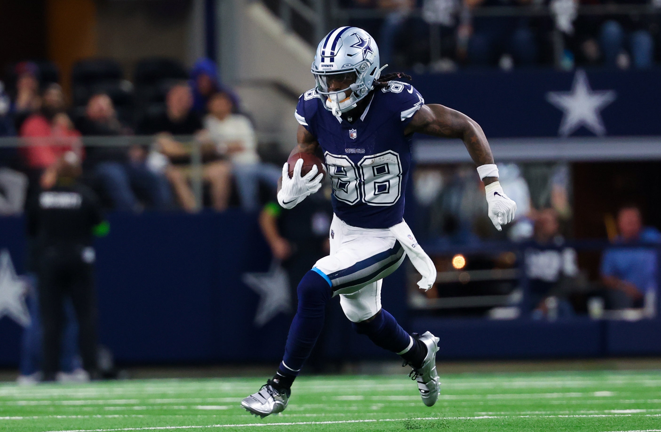 Dallas Cowboys wide receiver CeeDee Lamb (88) runs with the ball during the second half against the Detroit Lions at AT&T Stadium.