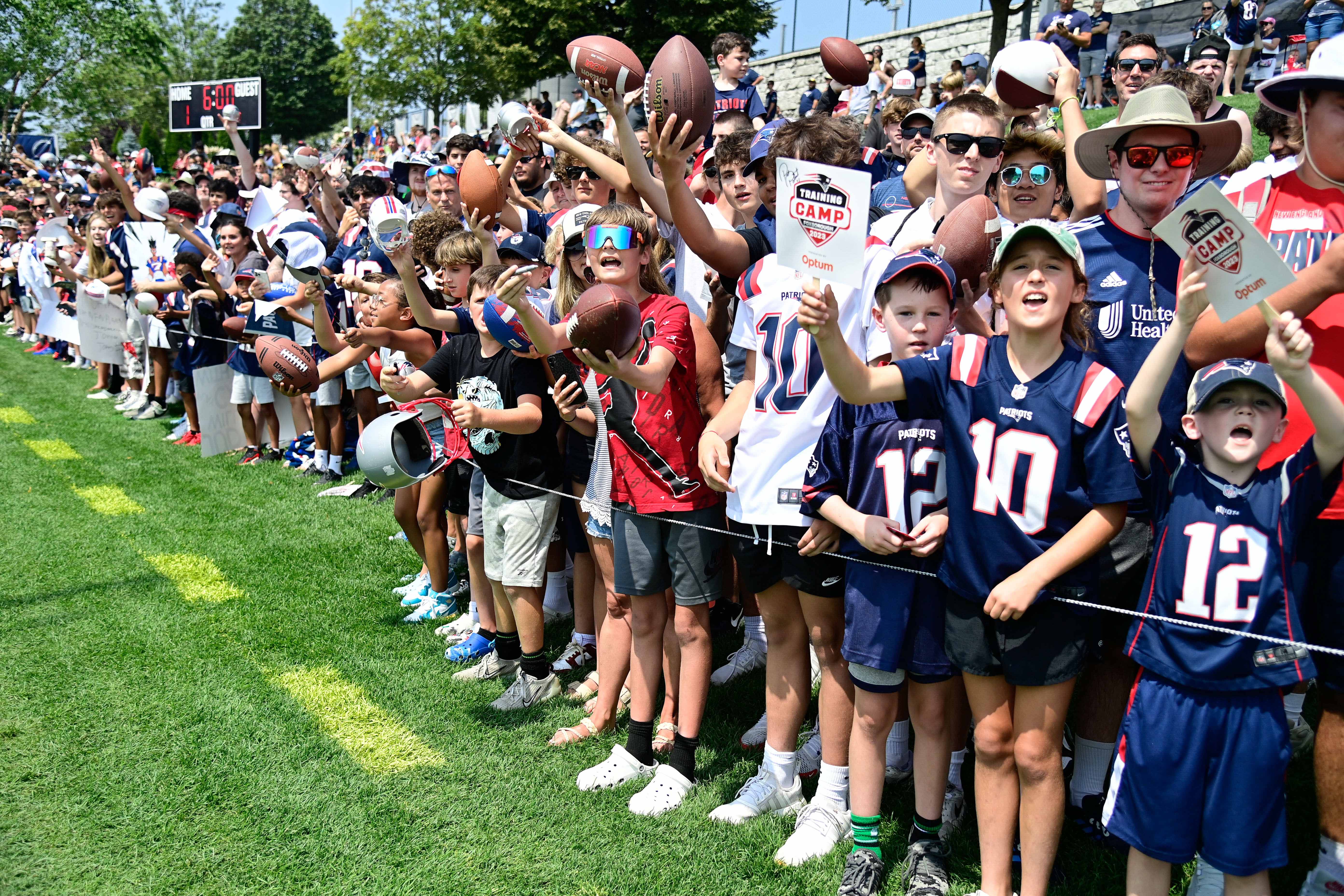 Jul 26, 2023; Foxborough, MA, USA; Fans lineup hoping to get an autograph from the their favorite New England Patriot during training camp at Gillette Stadium.