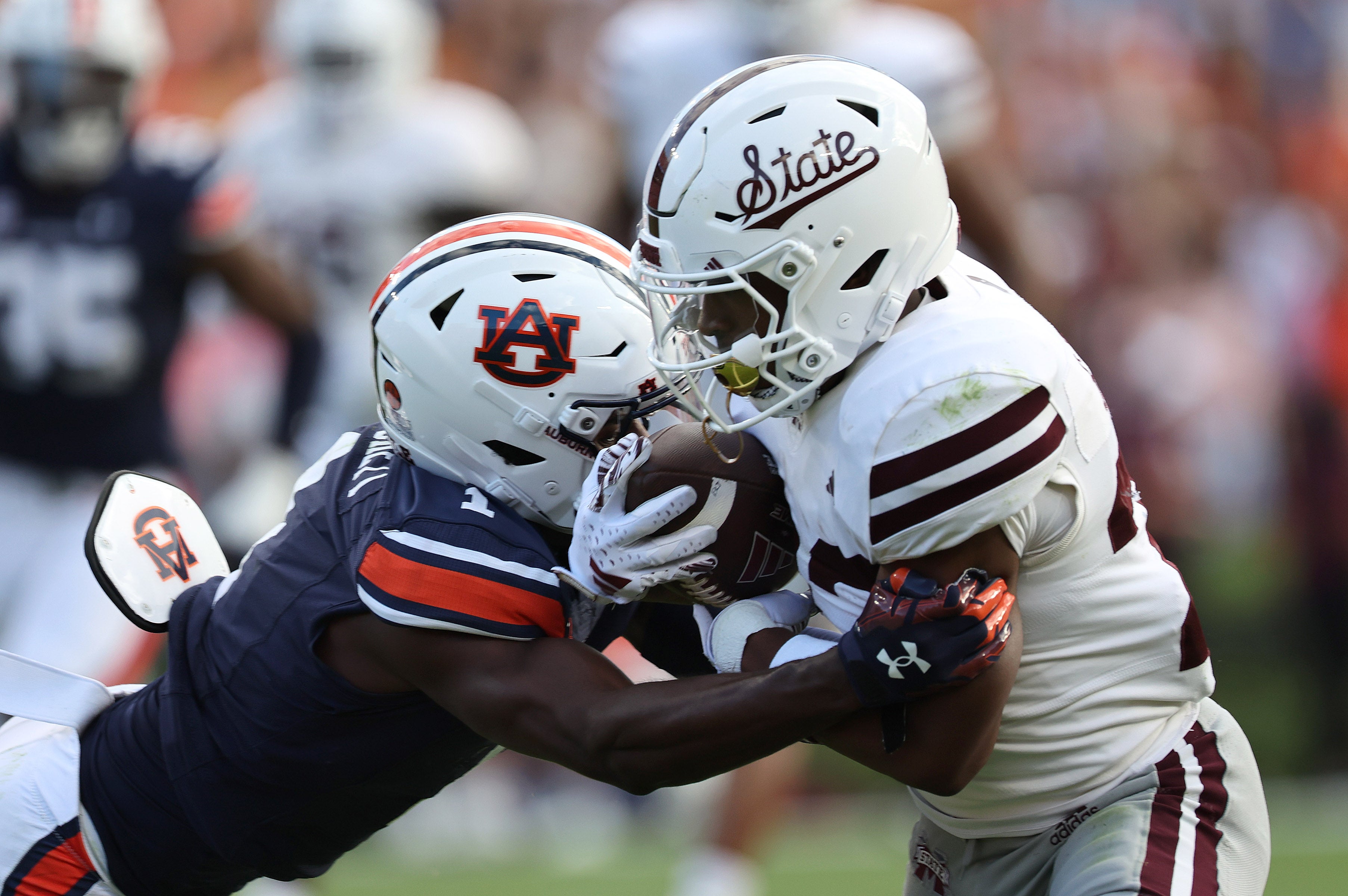 Oct 28, 2023; Auburn, Alabama, USA; Mississippi State Bulldogs running back Seth Davis (23) is tackled by Auburn Tigers cornerback Nehemiah Pritchett (1) during the third quarter at Jordan-Hare Stadium.