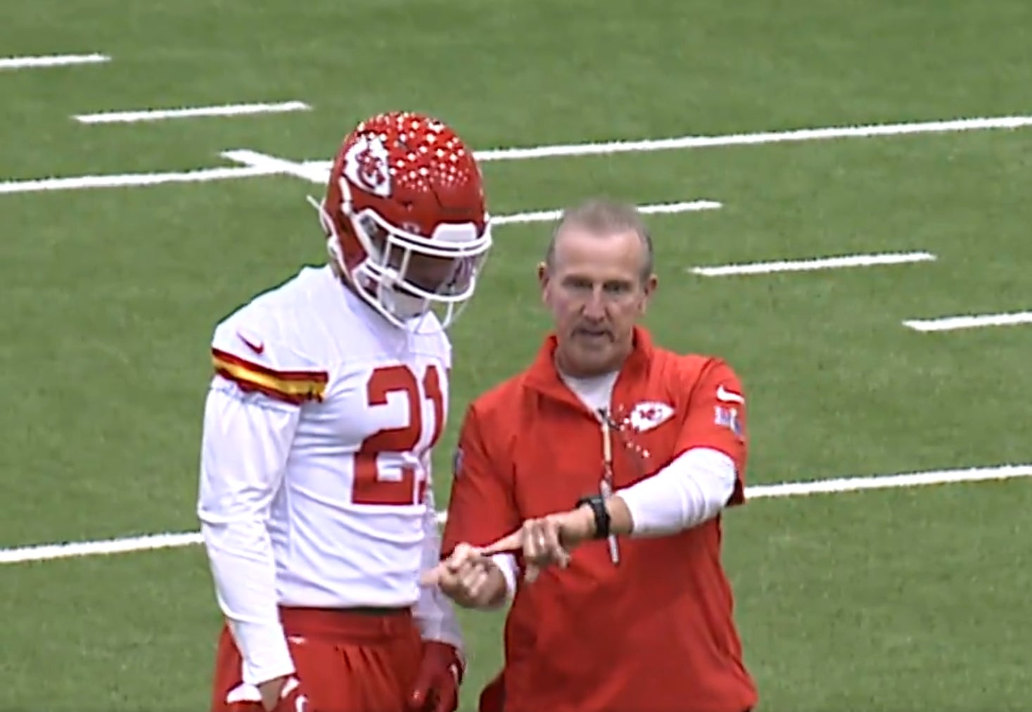 Chiefs safety Jaden Hicks and defensive coordinator Steve Spagnuolo.